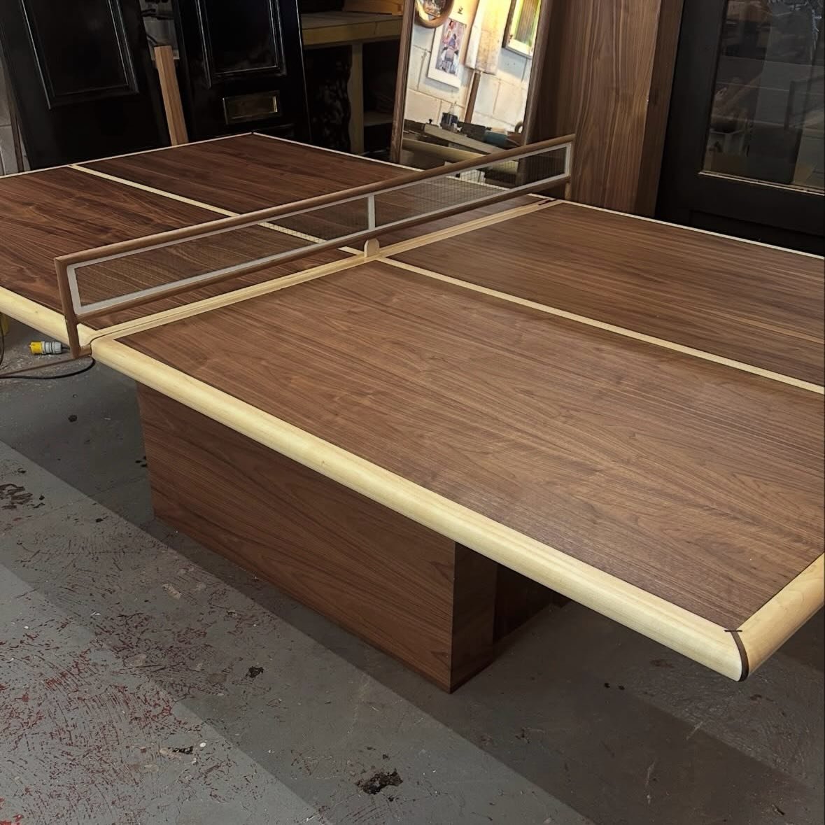 Ping pong anyone? 🏓

This gorgeous unique ping pong table is made from Walnut &amp; Maple wood. The base is reinforced with a metal frame which allows it to remain sturdy without compromising the look. 

This really is such a super cool piece 

DM u