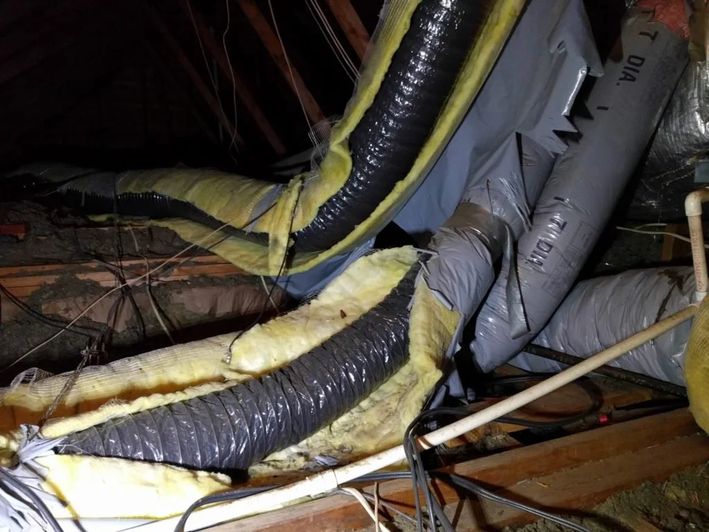 Damaged and sagging HVAC ductwork in attic of Anaheim Hills hillside home