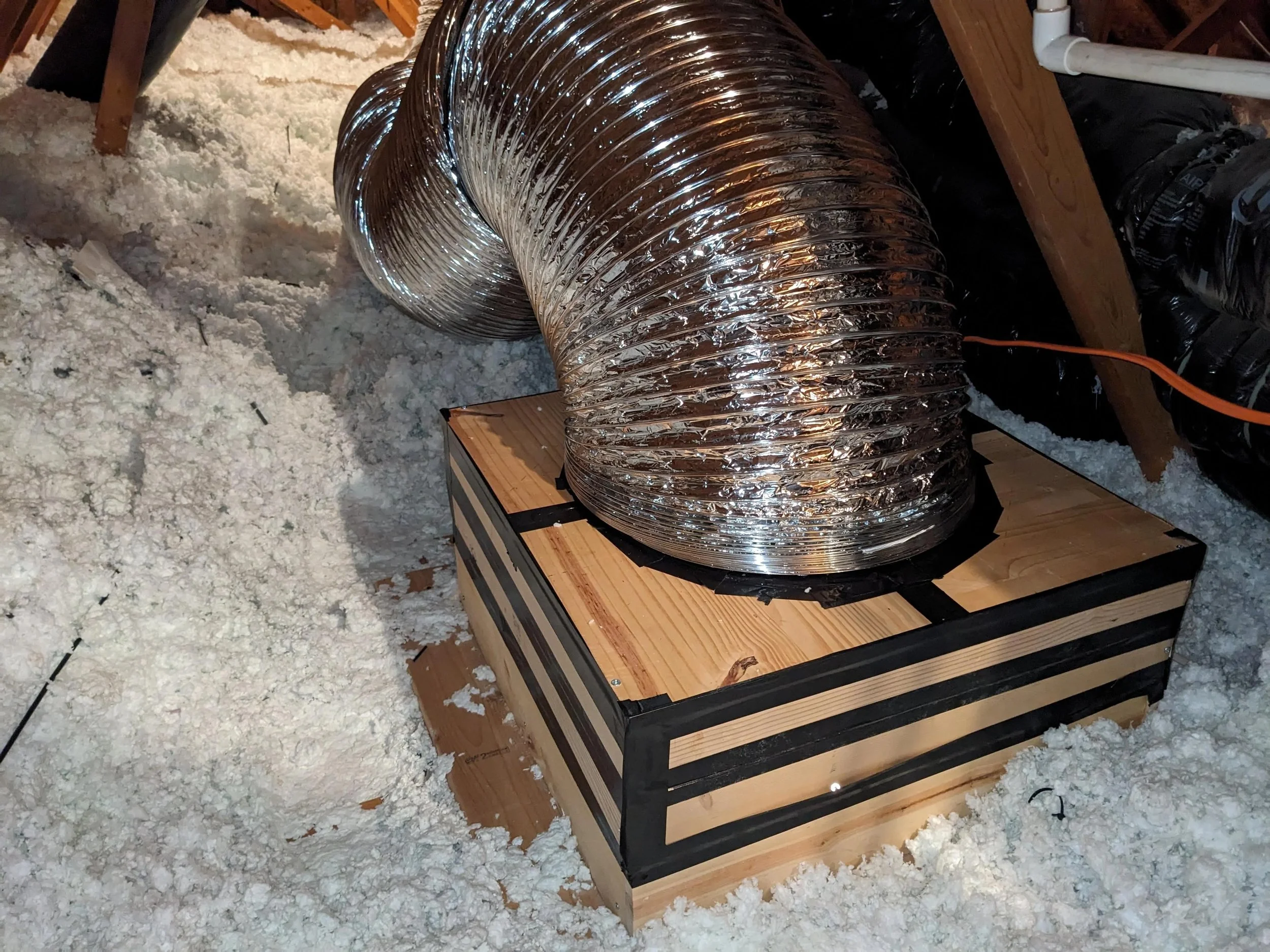 whole house fan attic installation with insulated duct and sealed box for ventilation