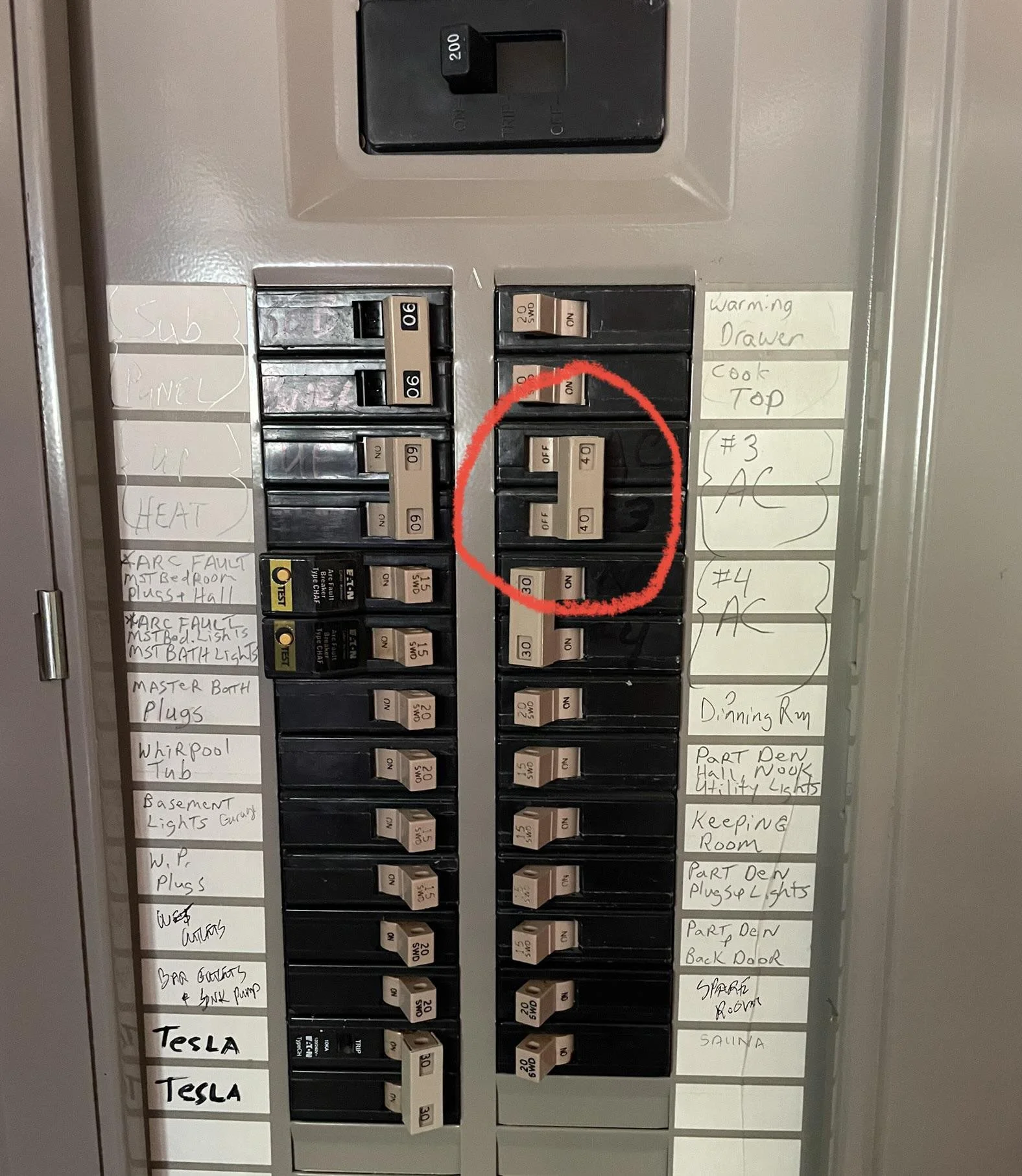 tripped AC circuit breaker on a residential electrical panel, one of the most common causes of AC not cooling that Anaheim Hills homeowners can check before calling for service