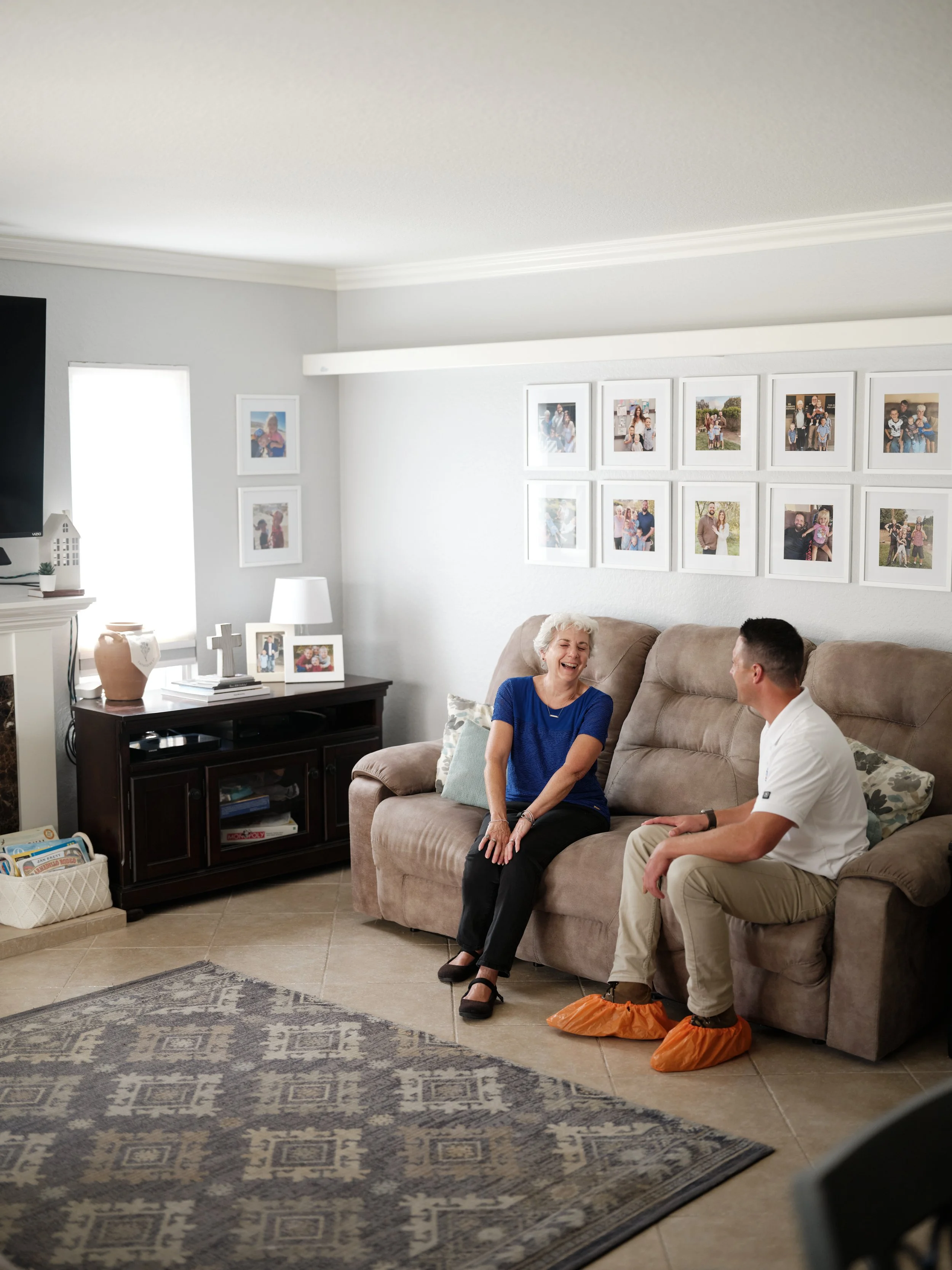HVAC technician discussing system replacement options with homeowner in Yorba Linda living room