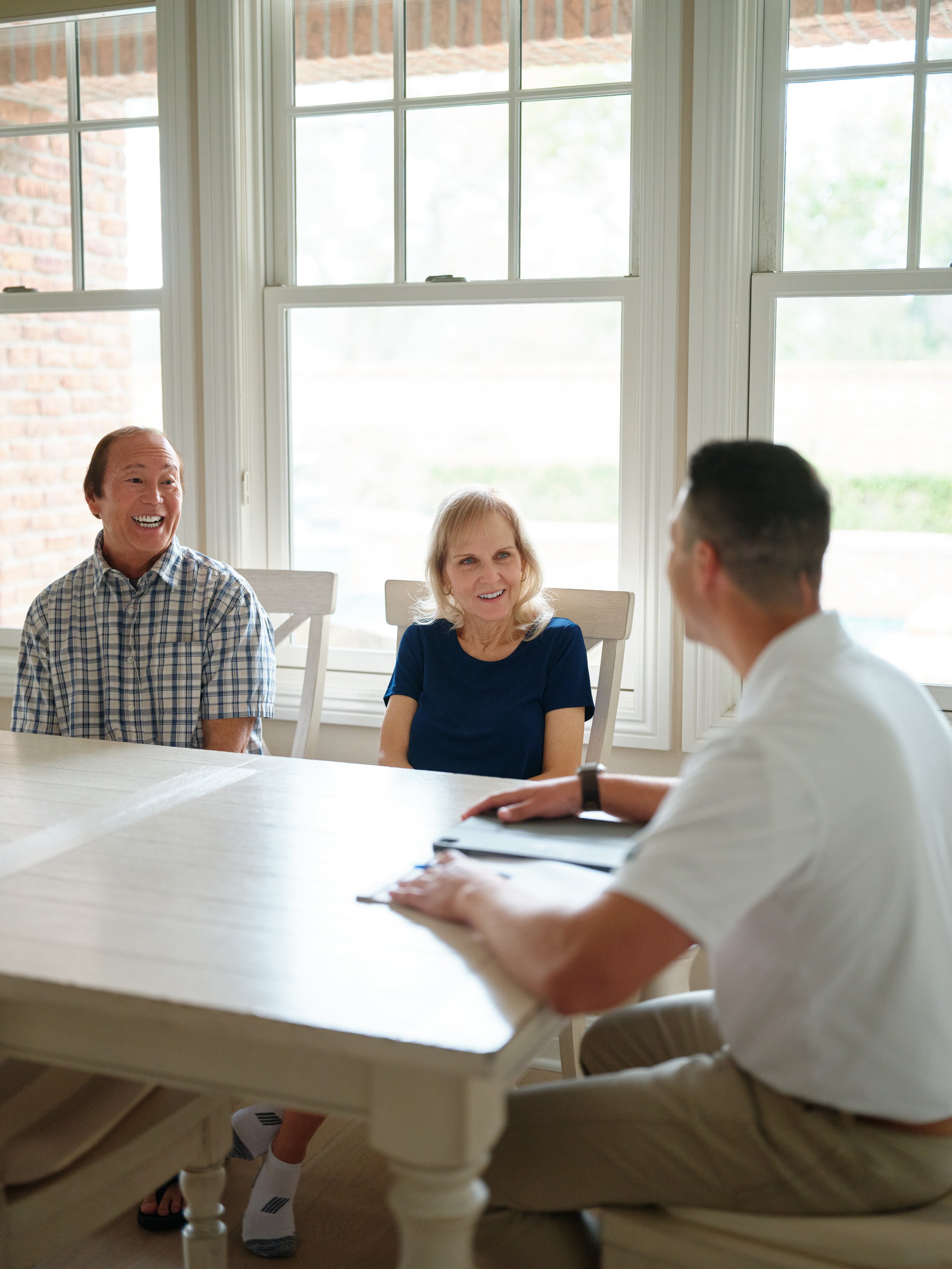 Orange County homeowners consulting with J Martin HVAC expert about humidity control solutions