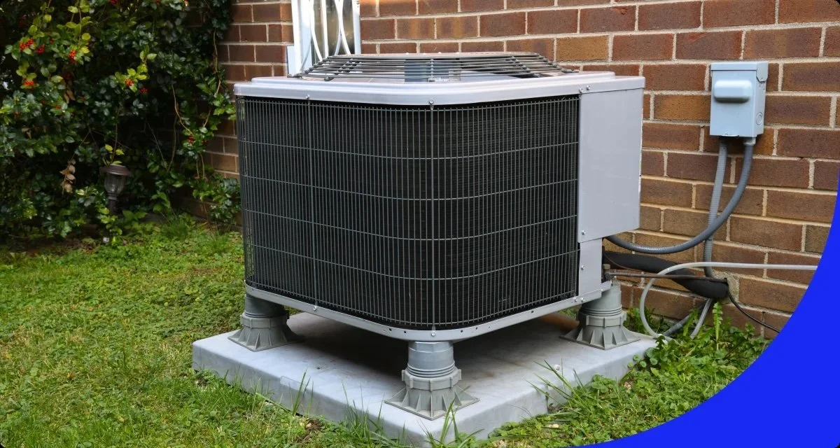 outdoor AC condenser unit professionally installed on a concrete pad next to a brick home, with isolation feet, accessible electrical disconnect, and clear airflow on all sides