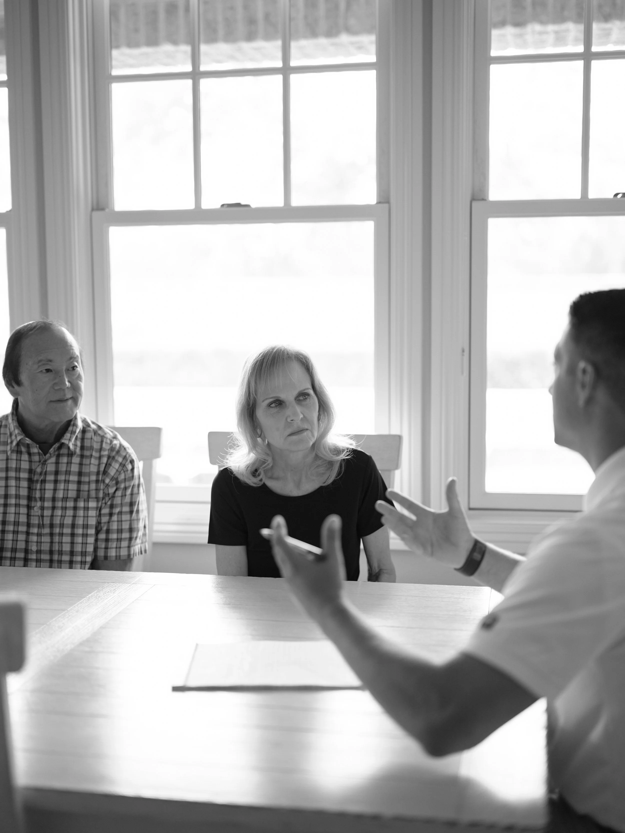 Martin Indoor Air Quality technician consulting with Orange County homeowners about ductless mini split installation options