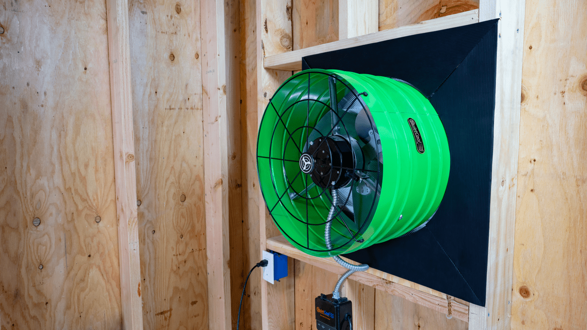 QuietCool whole house fan installed in attic showing ducted ventilation system for home cooling