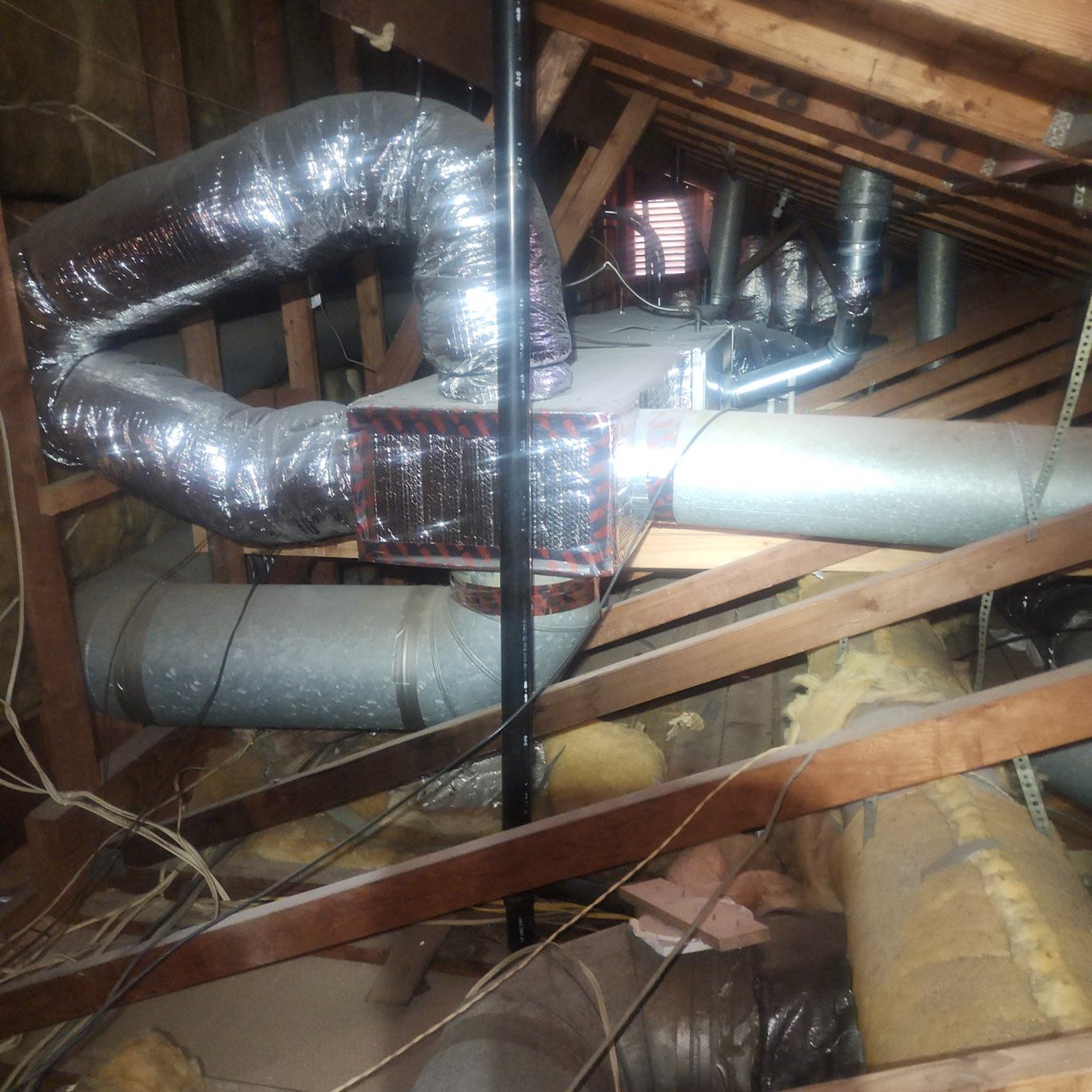 HVAC ductwork and air handler installed in attic space during home HVAC inspection in Yorba Linda