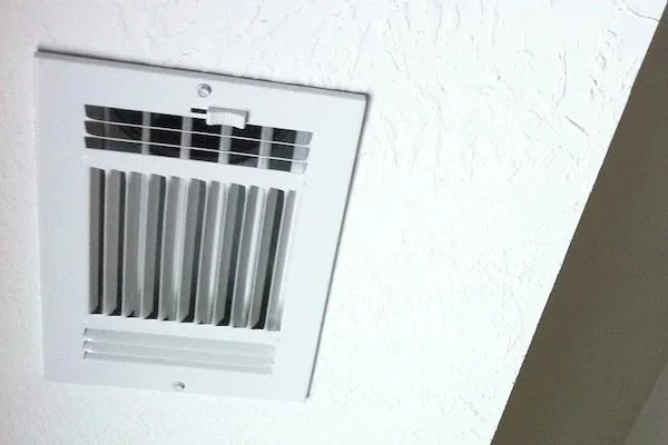 ceiling air vent in Orange County home showing airflow from HVAC system for upstairs cooling