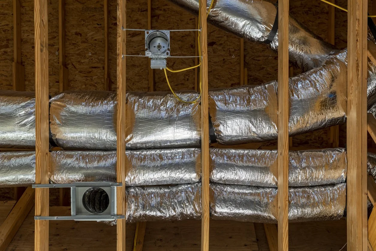 new insulated flex ductwork installed in a residential attic for central AC in Orange County