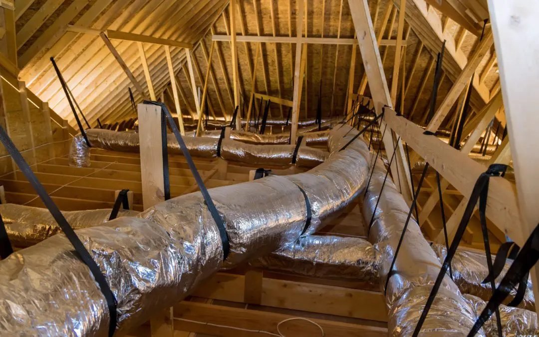 Attic HVAC ductwork system showing insulated air ducts for improving indoor air quality in homes