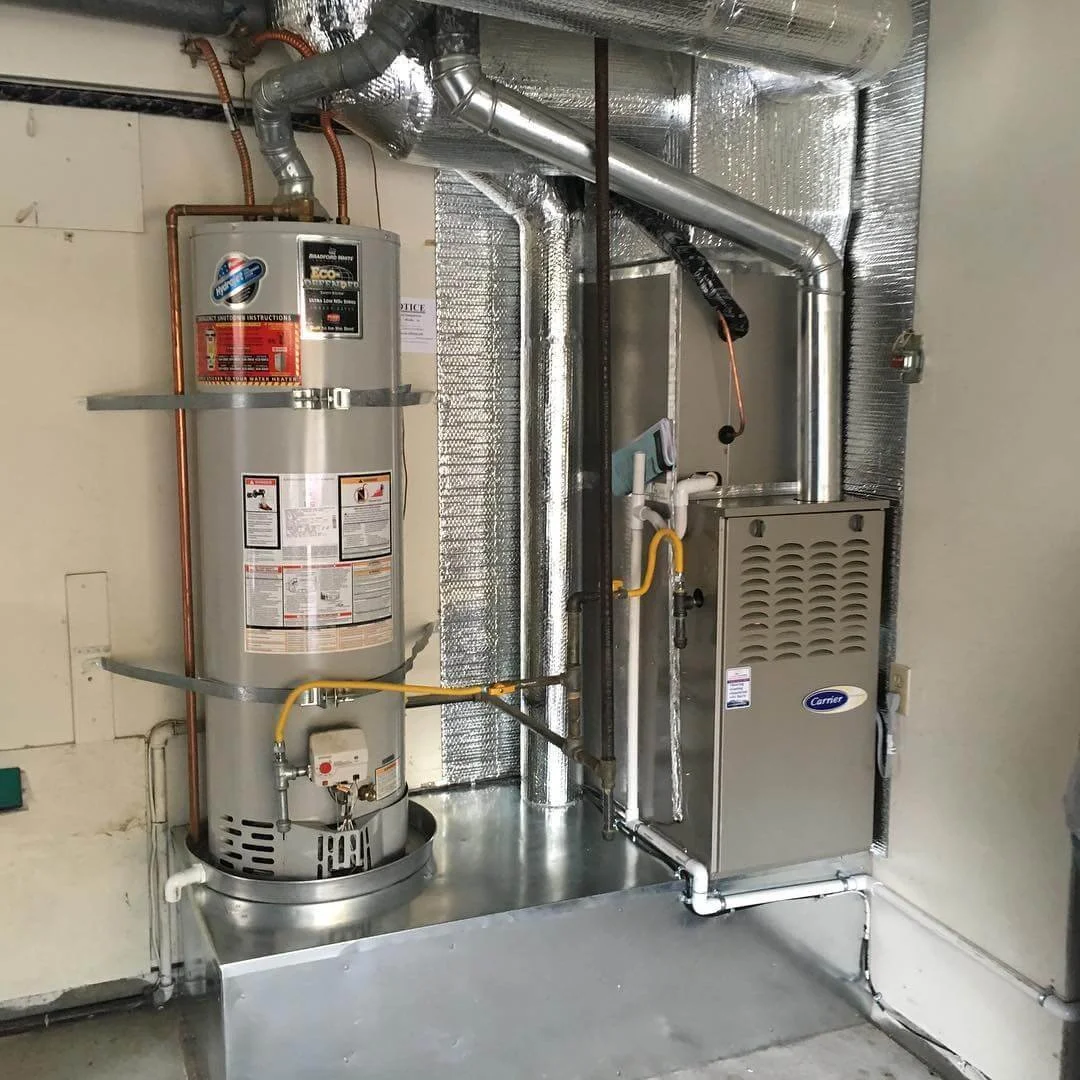 Carrier gas furnace and Bradford White water heater installation in utility room serviced by J Martin IAQ in Orange County
