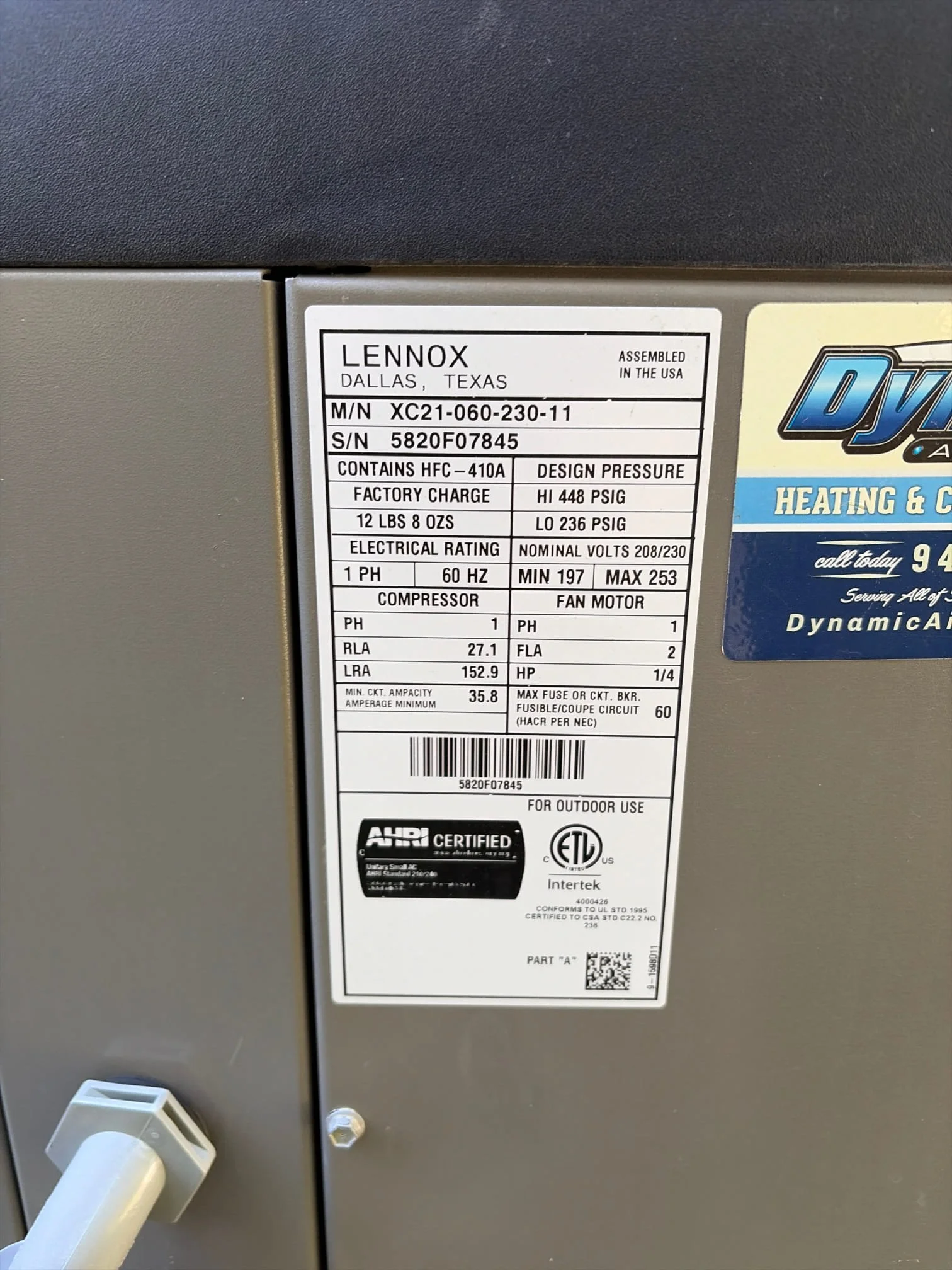 Close-up of a Lennox HVAC condenser unit data plate showing model number, serial number, and HFC-410A refrigerant type, illustrating what Yorba Linda home buyers should look for when evaluating an air conditioning system before purchase