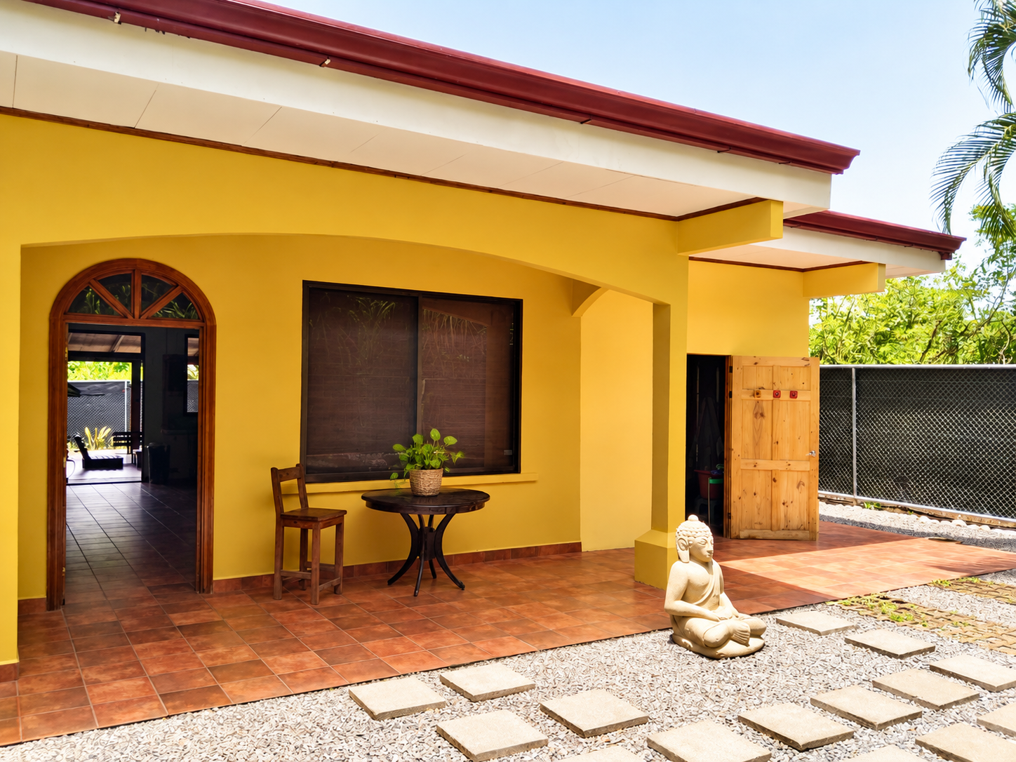 Casa Palma Bonita home for sale near Santa Teresa Costa Rica with yellow exterior and covered front porch