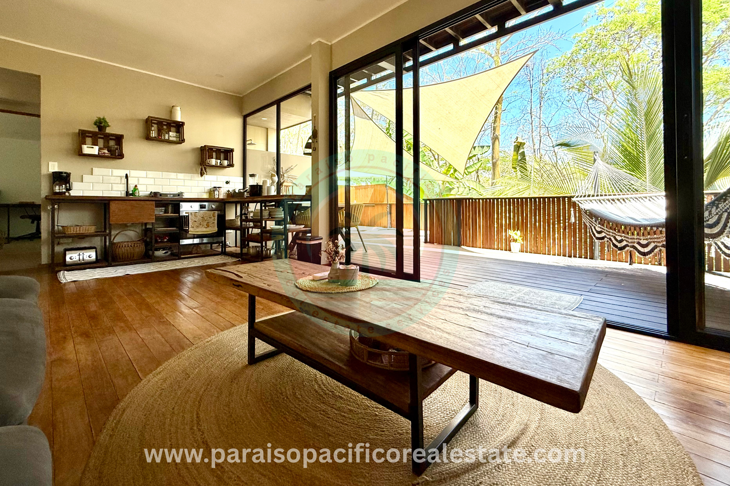 Indoor dining and kitchen area at Buddha House Organos near the beach in Costa Rica