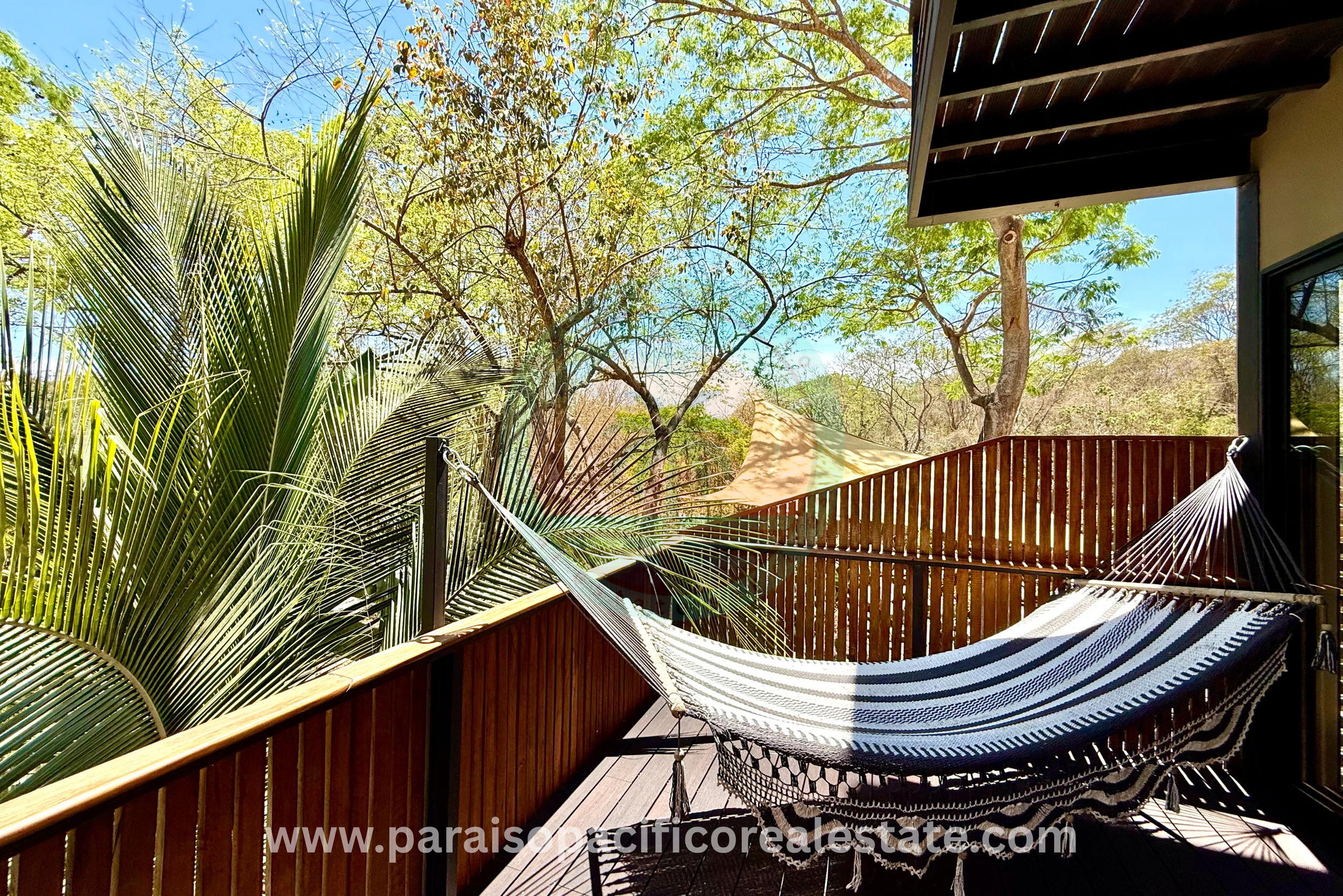 Outdoor hammock on patio at Buddha House Organos near the beach in Costa Rica