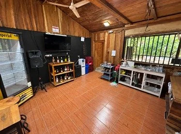 Wood-paneled entertainment area with sound equipment at commercial hospitality property in Tambor.