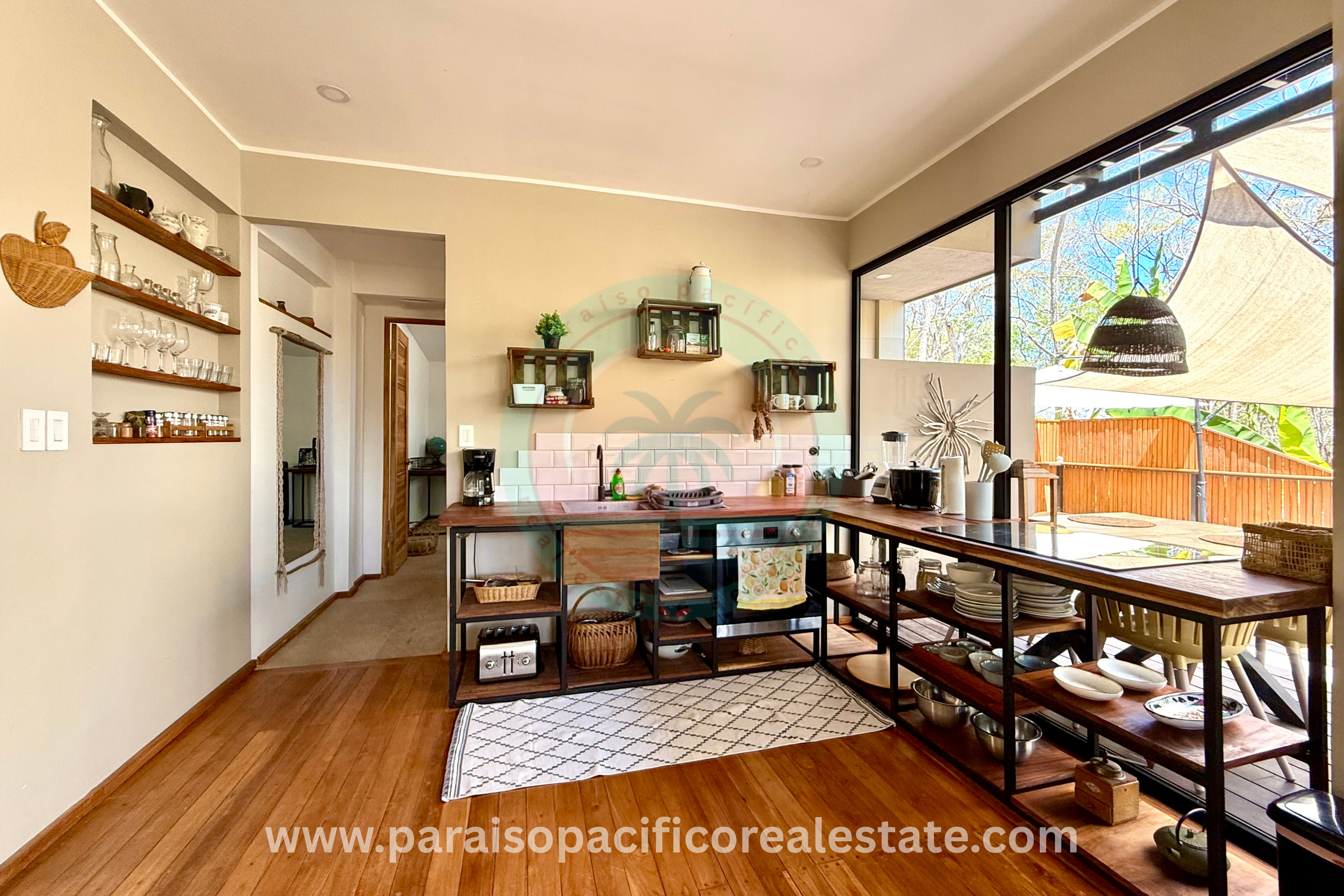 Indoor dining and kitchen area at Buddha House Organos near the beach in Costa Rica