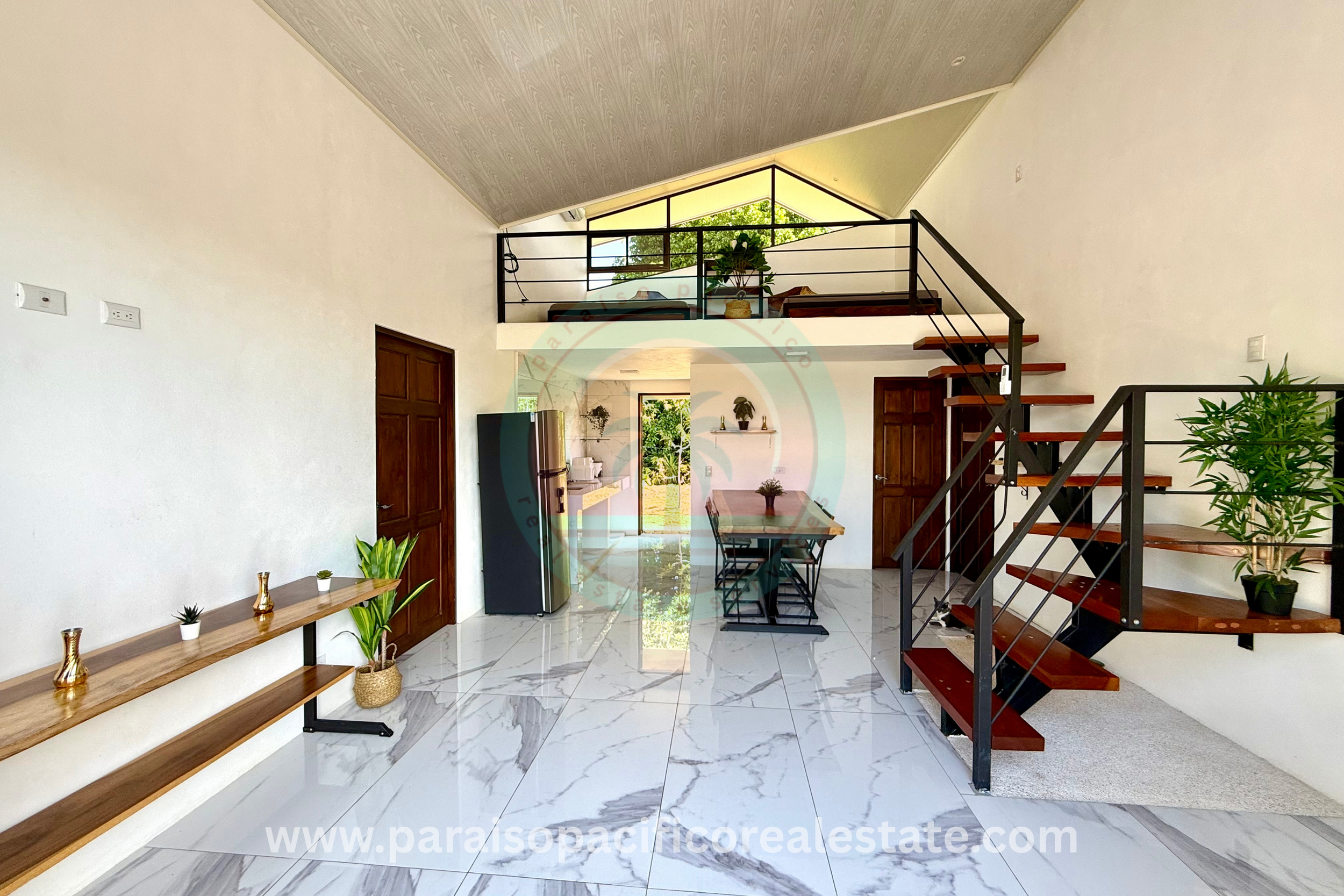 Modern House of Santa Fe of Cobano Costa Rica Main floor view to loft.png