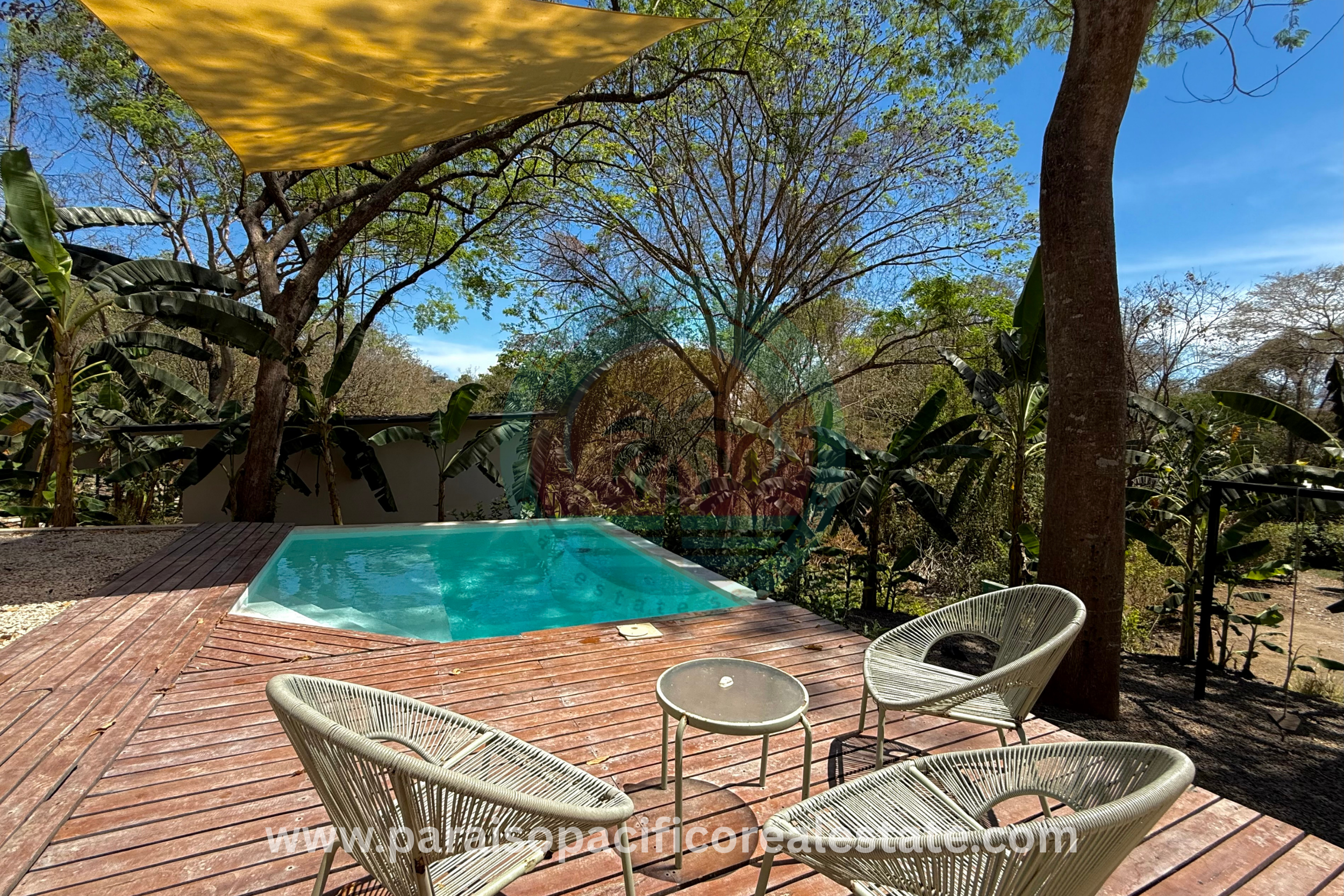 Outdoor pool and patio at Buddha House Organos near the beach in Costa Rica
