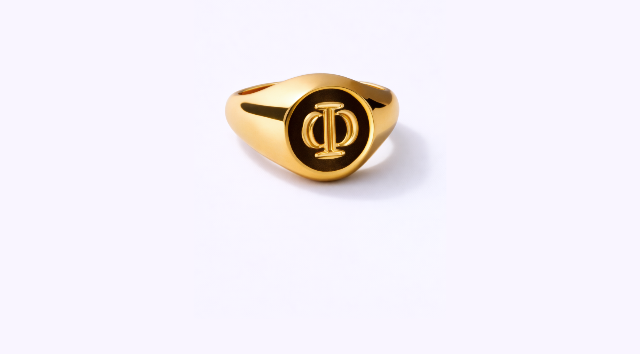 Gold ring with Greek letter Phi engraved on top, isolated on white background.
