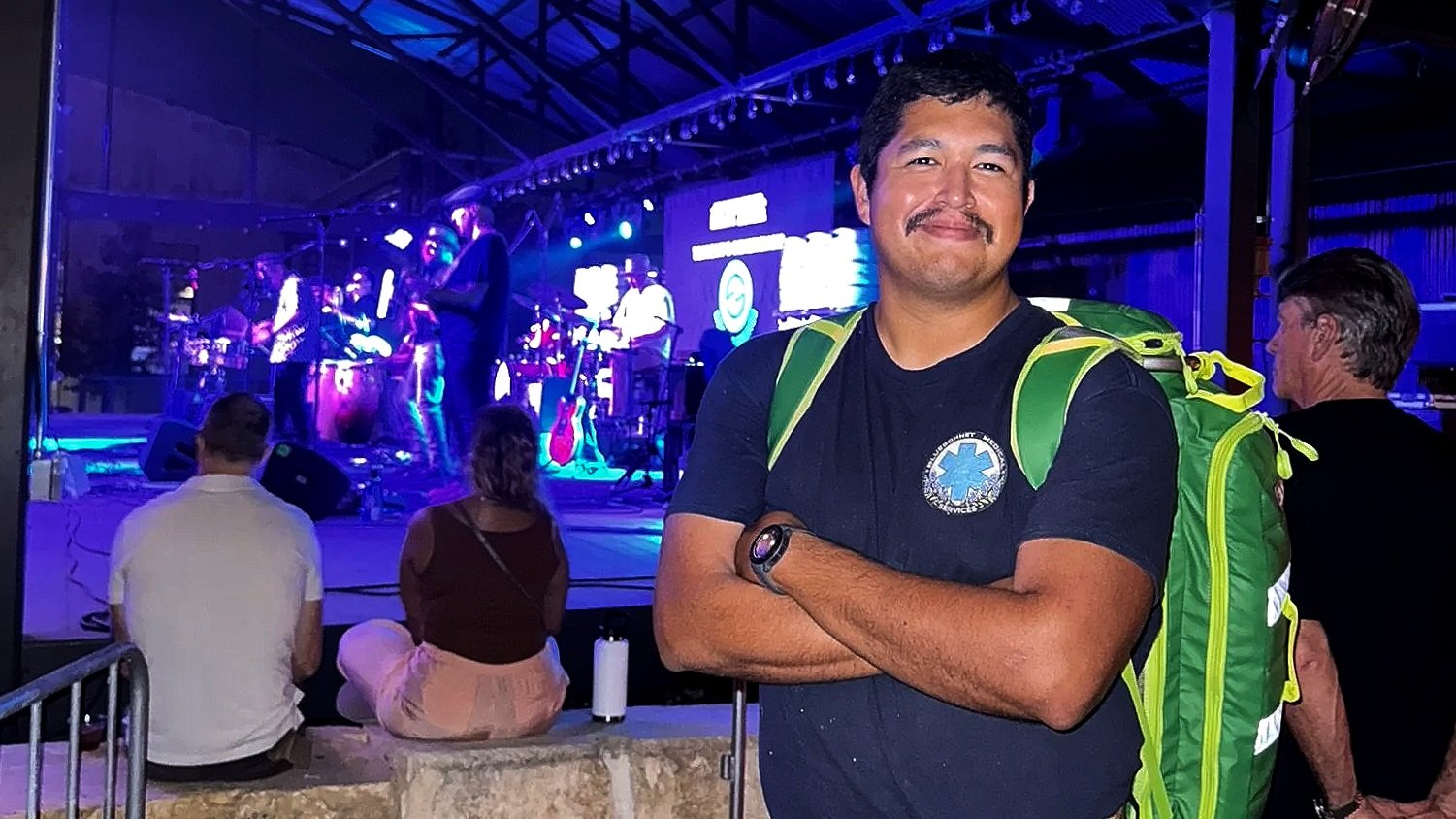 Roaming EMT with medical backpack providing on-site medical coverage at live concert in Austin, Texas