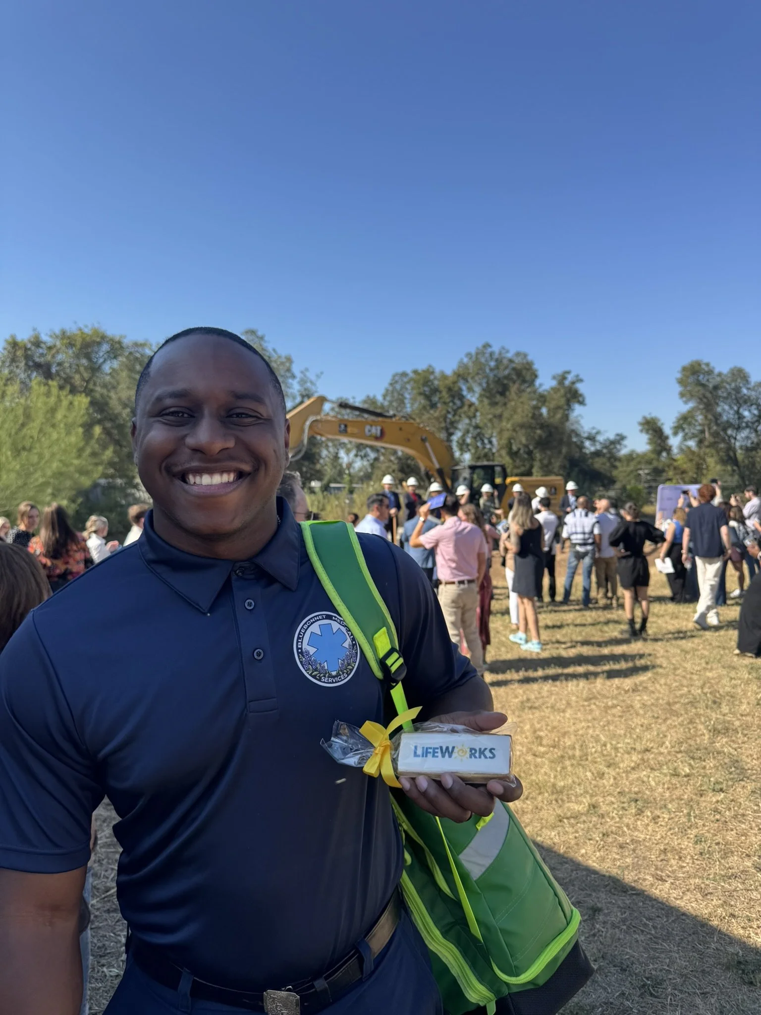 Uniformed EMT providing medical standby at construction groundbreaking event in Central Texas