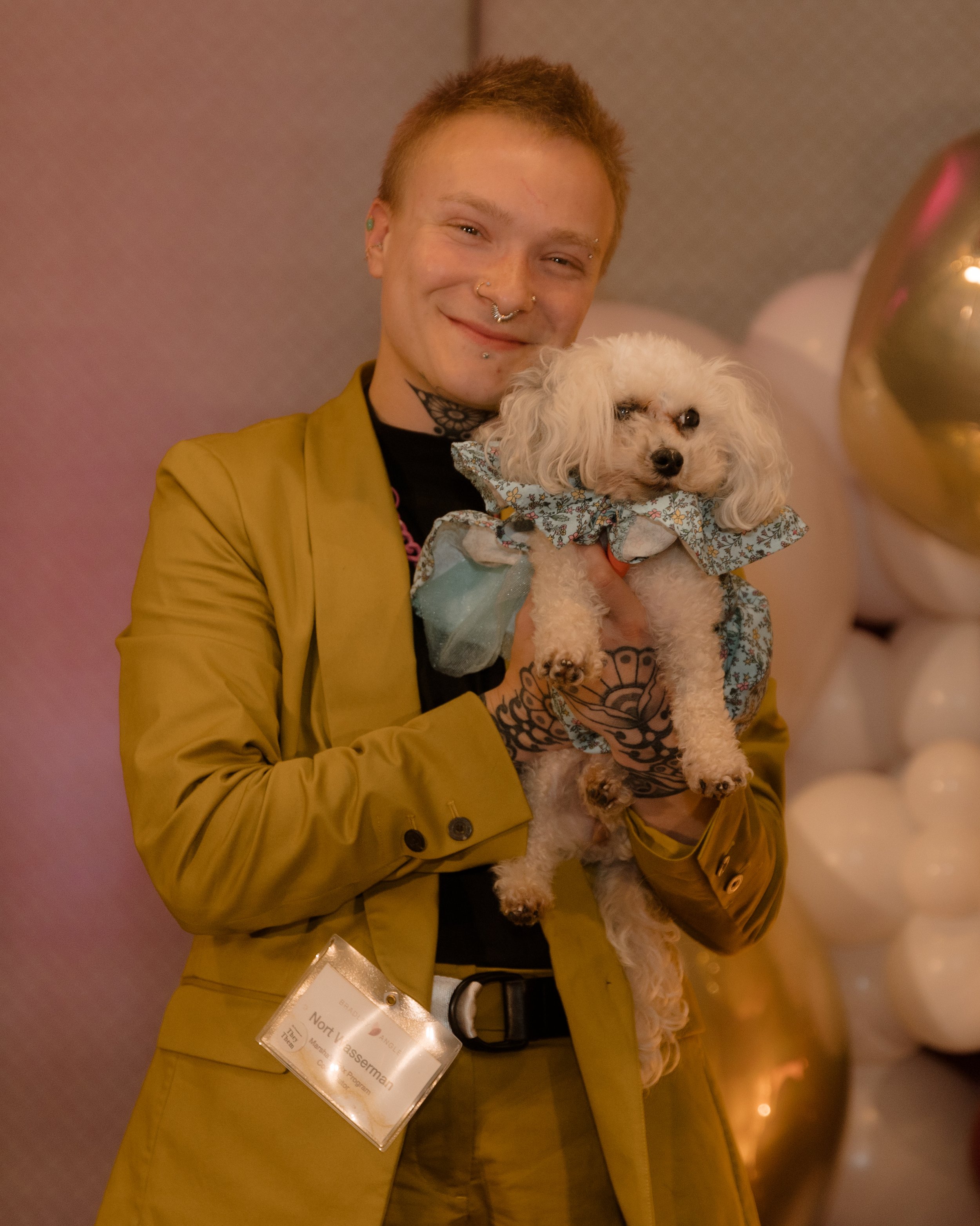 Photo of Nort Wasserman holding a fluffy white dog