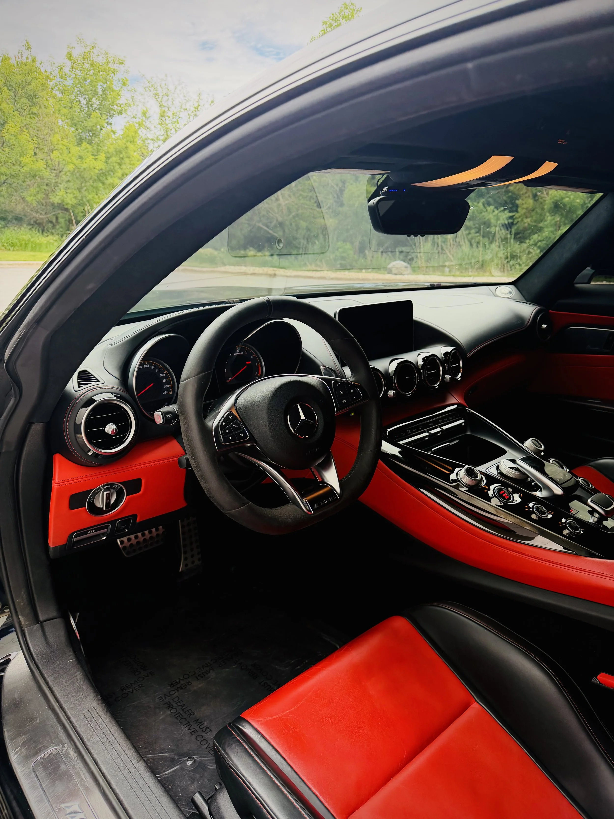 Black Mercedes-AMG GT S with a red leather interior available for rental in Chicago.
