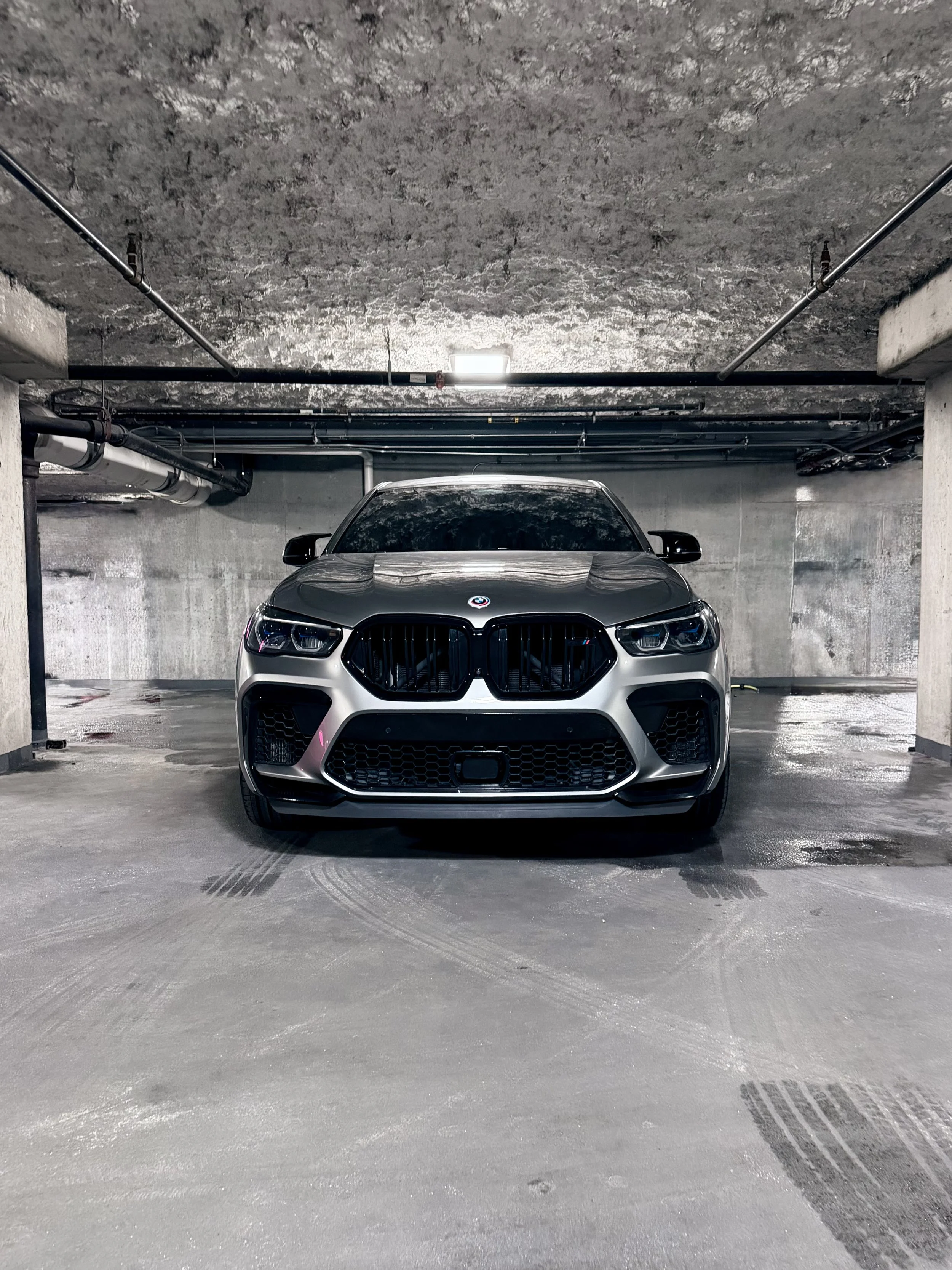 BMW X6 M Competition metallic silver luxury performance SUV with red leather interior