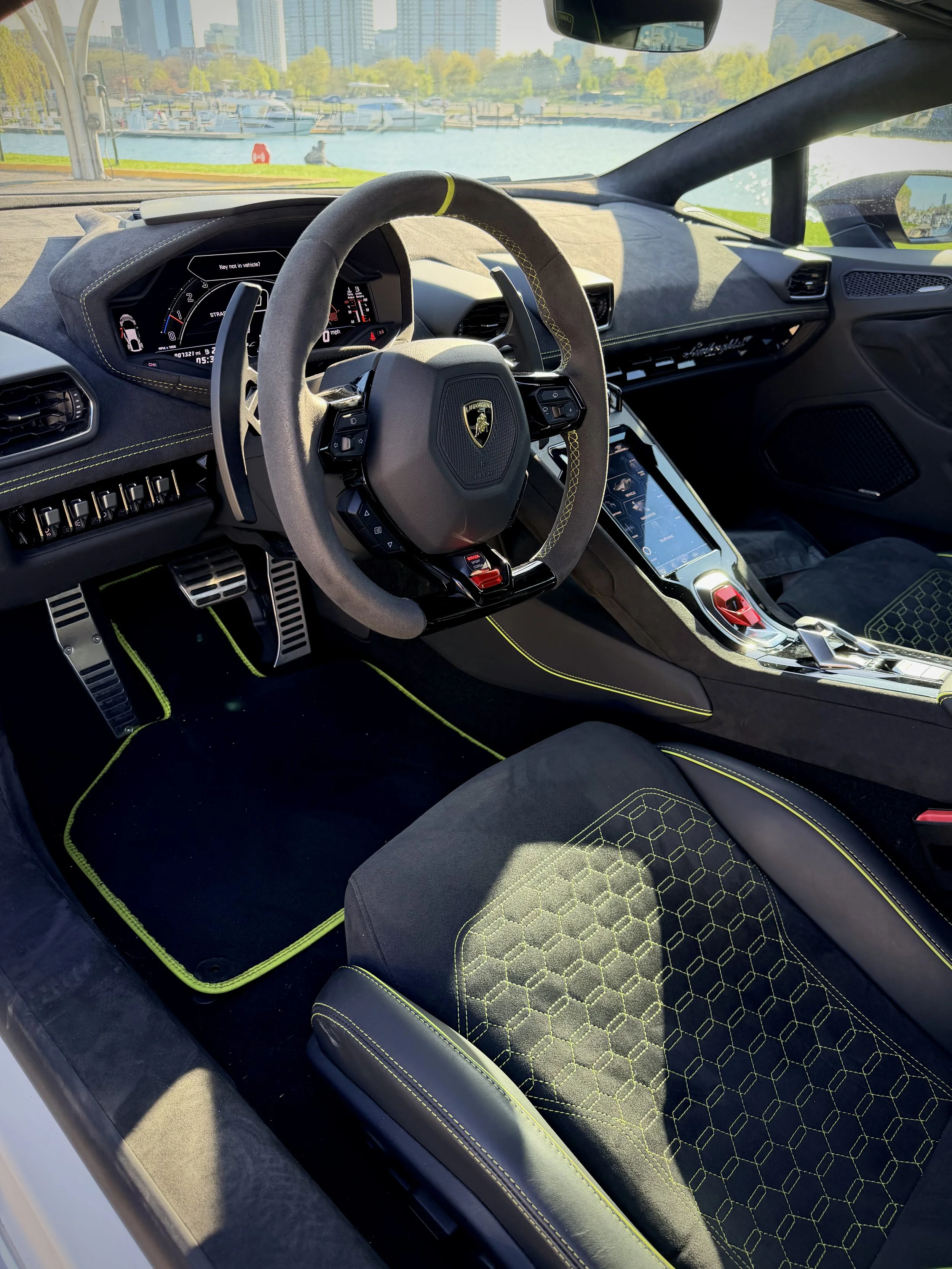 Lamborghini Huracán Tecnica satin black with green brake calipers luxury rental Chicago