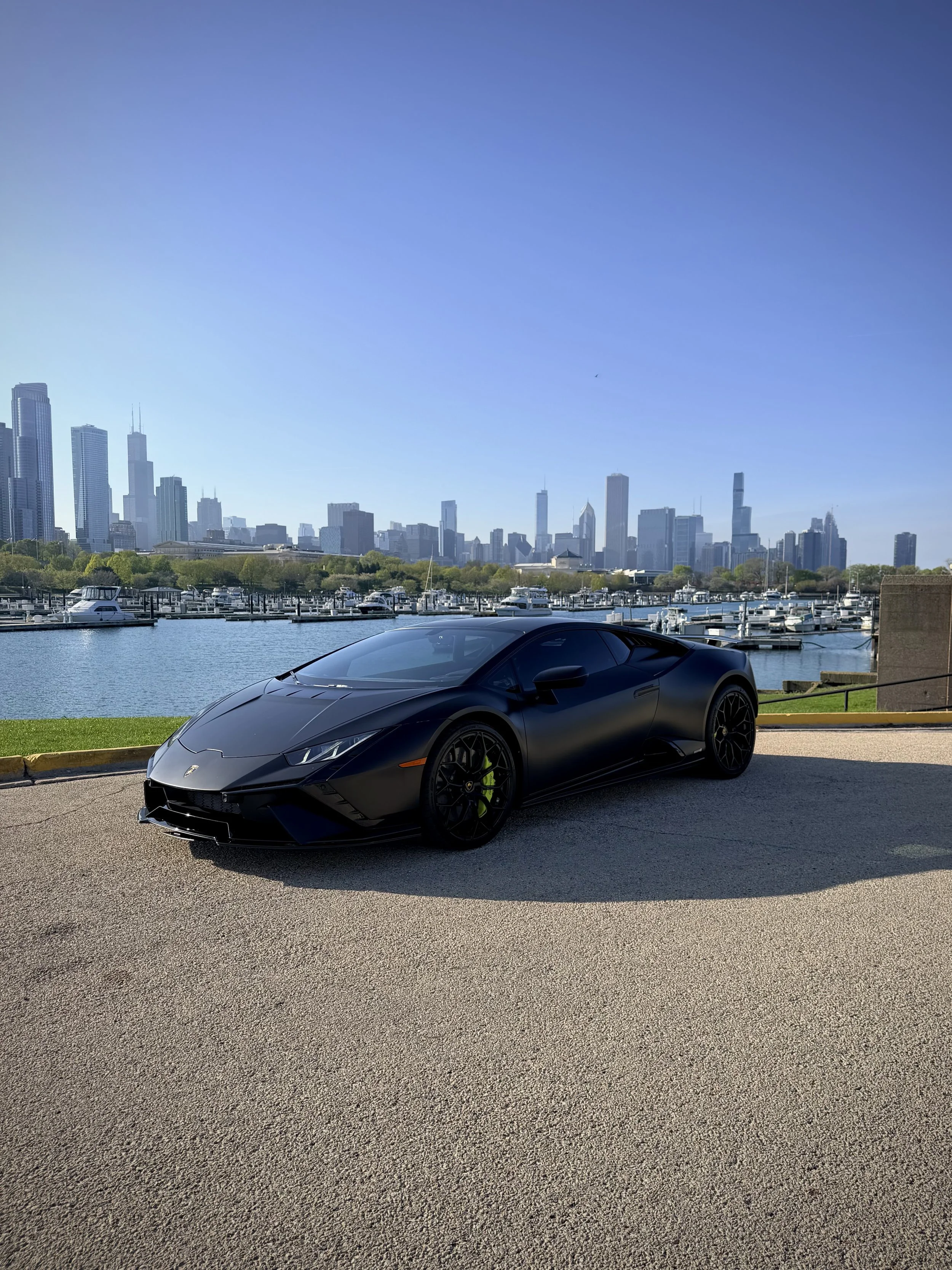 Lamborghini Huracán Tecnica satin black with green brake calipers luxury rental Chicago