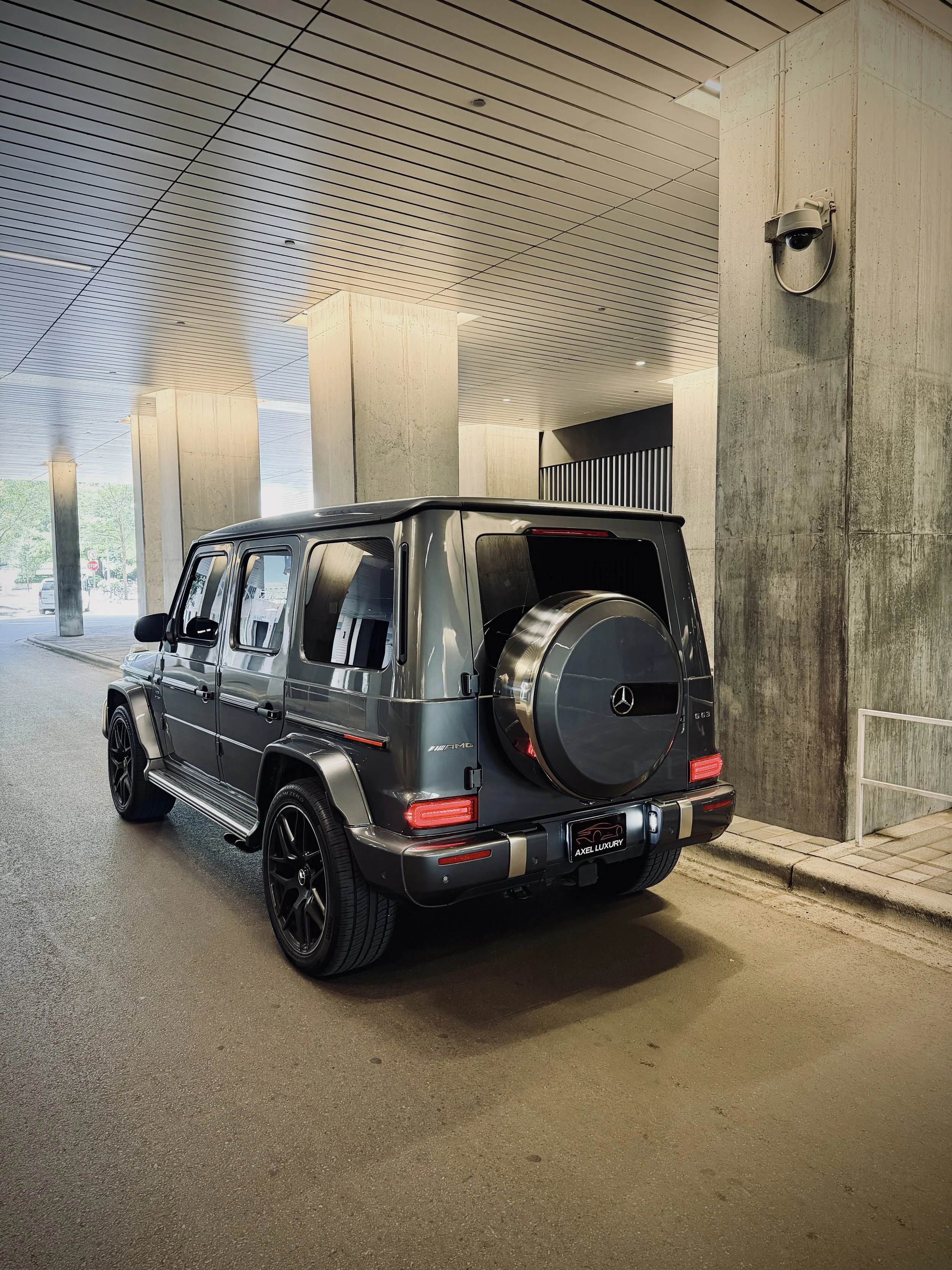 Graphite Metallic Gray Mercedes-Benz G63 AMG luxury SUV parked in Chicago available for rental through Axel Luxury.