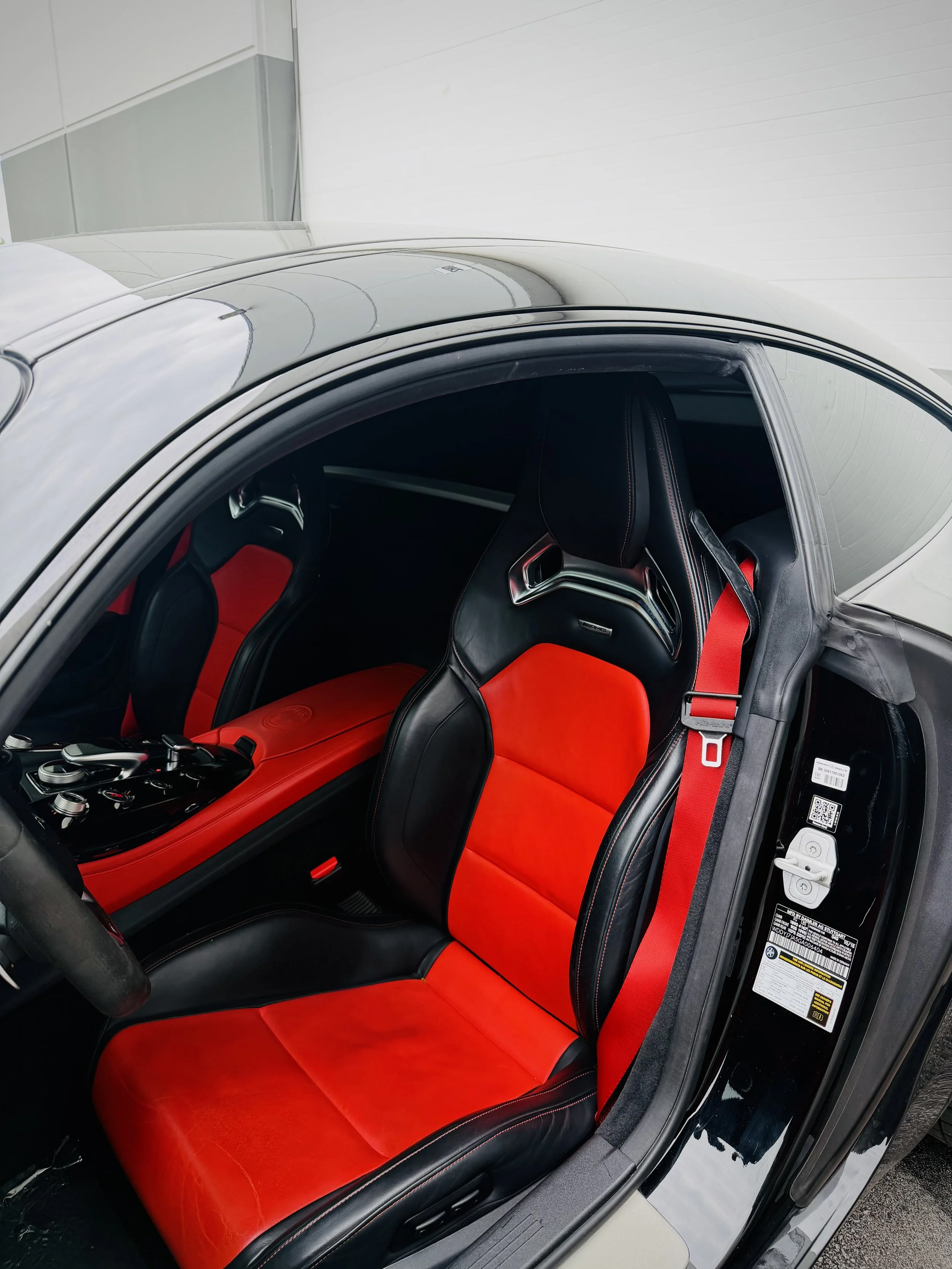 Black Mercedes-AMG GT S with a red leather interior available for rental in Chicago.