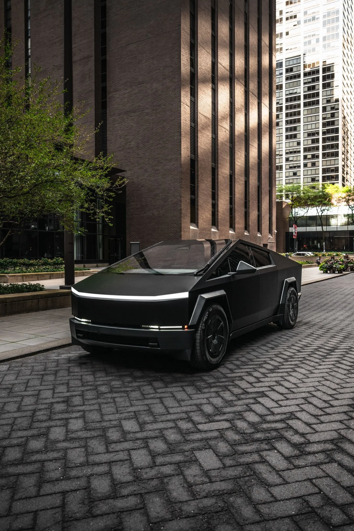 Satin Black Tesla Cybertruck rental in Chicago from Axel Luxury, showcasing futuristic design, armored exterior, and luxury electric performance.