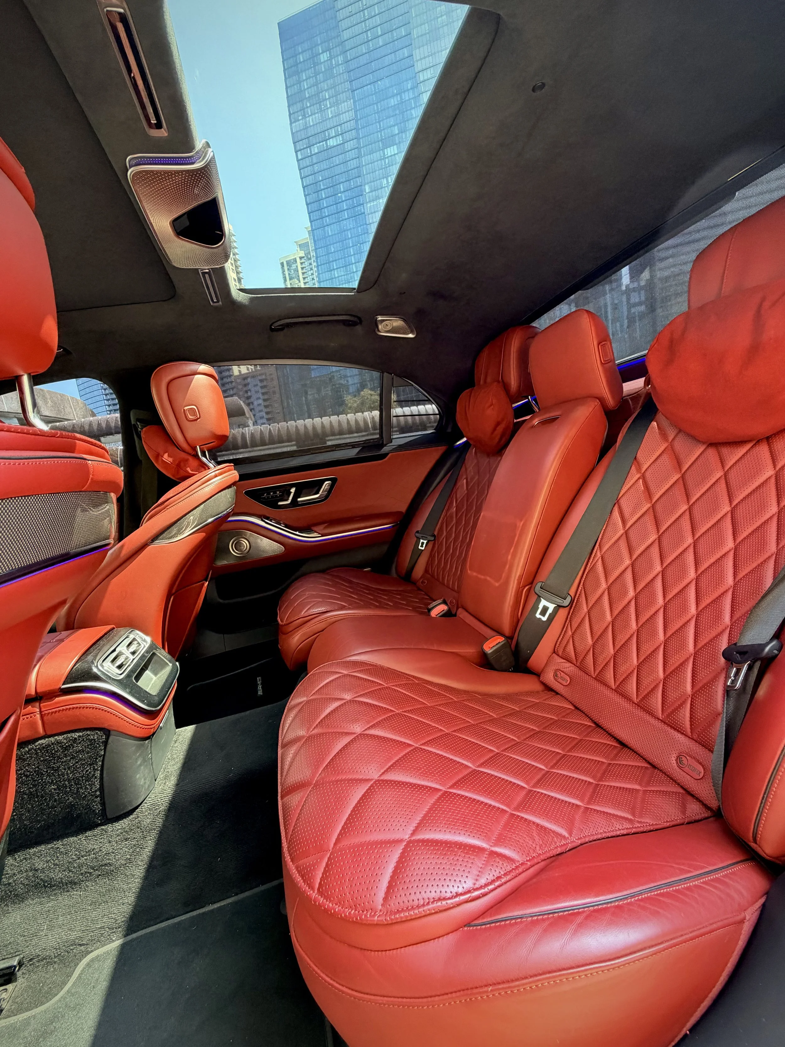 Matte Graphite Gray Mercedes-Benz S580 luxury sedan parked in downtown Chicago available for rental.