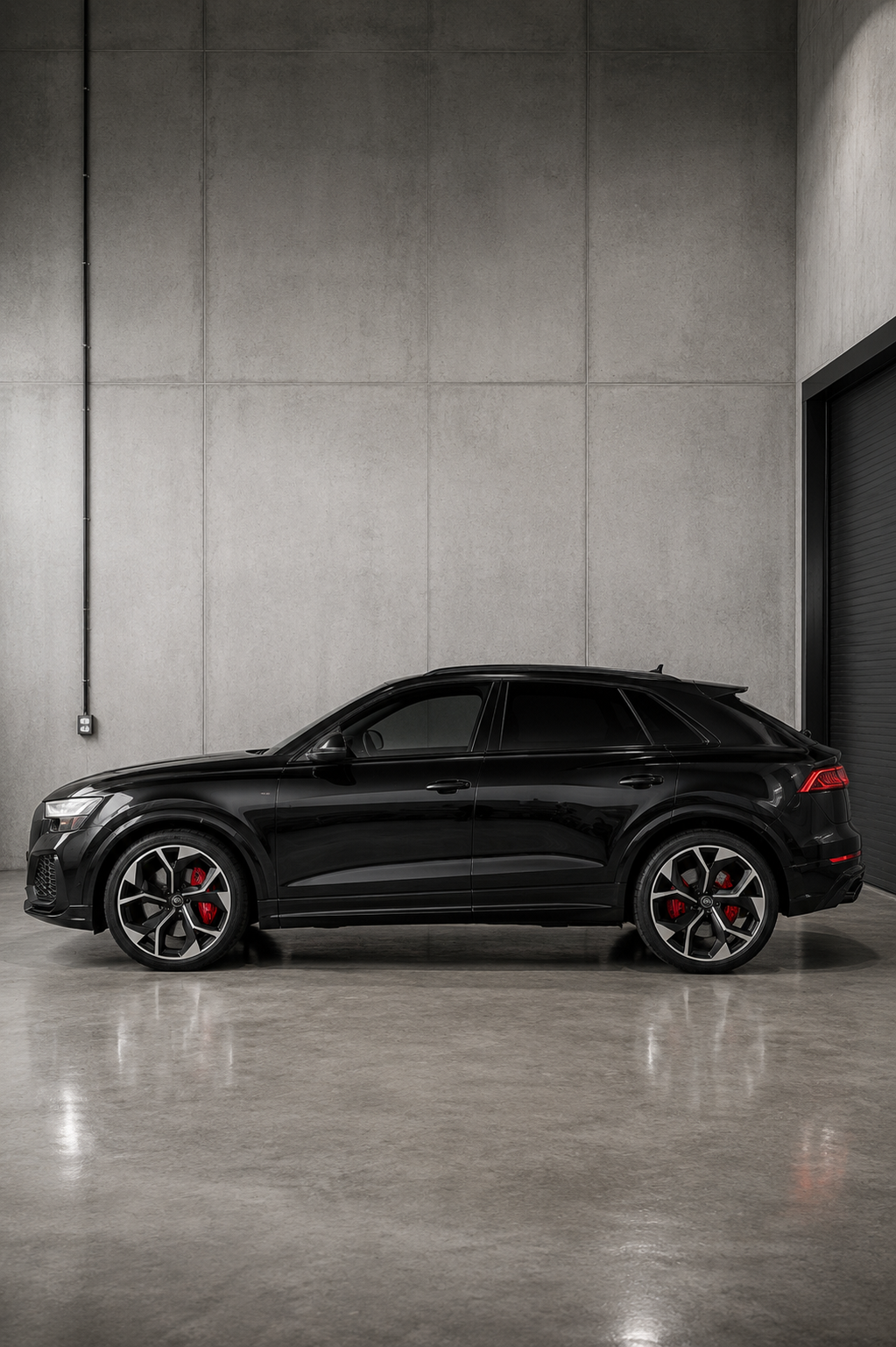 Black Audi RS Q8 rental in Chicago featuring a luxurious tan leather interior, aggressive RS styling, and a high-performance twin-turbo V8 SUV available for luxury and exotic car rental.