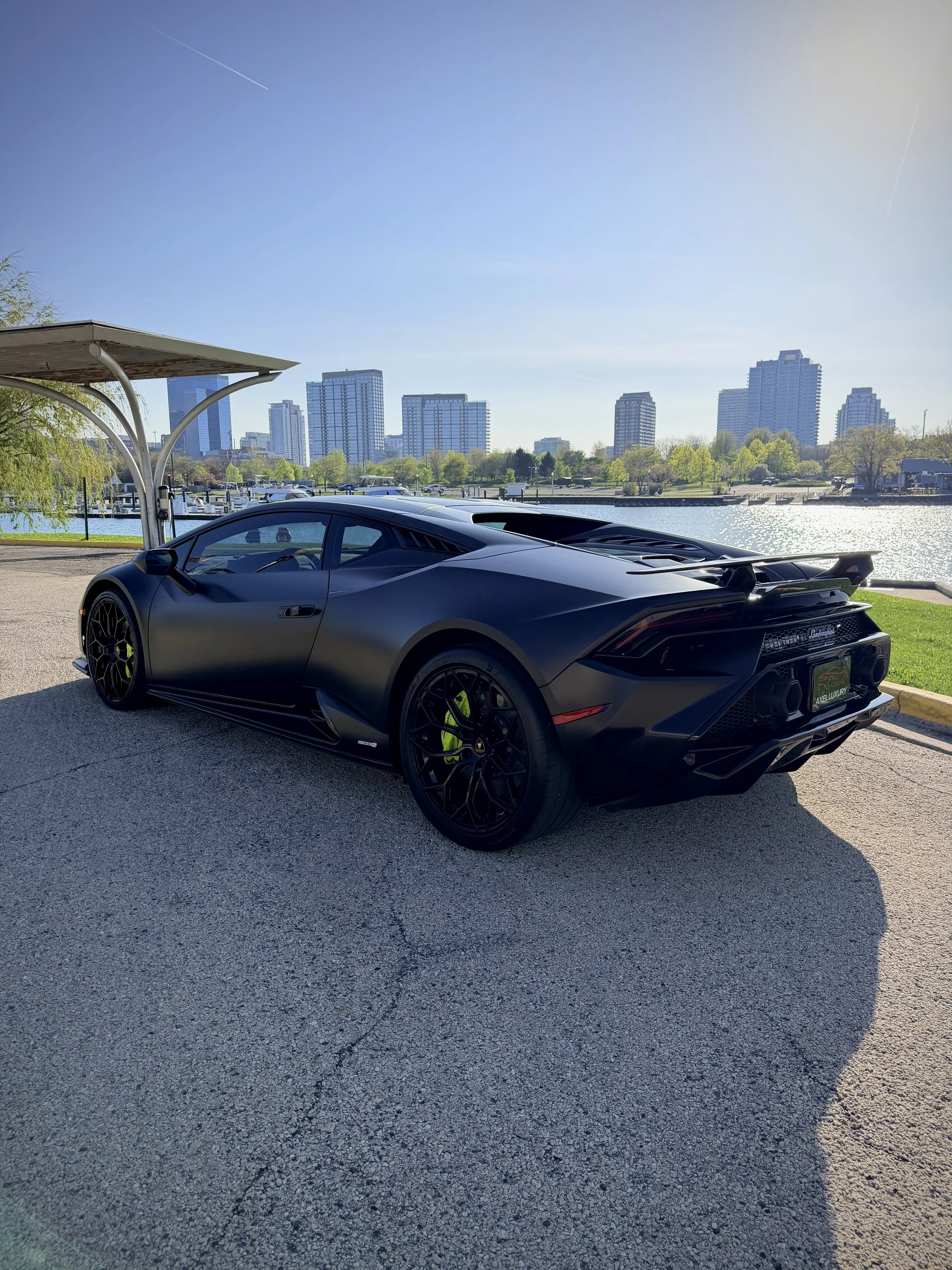 Lamborghini Huracán Tecnica satin black with green brake calipers luxury rental Chicago