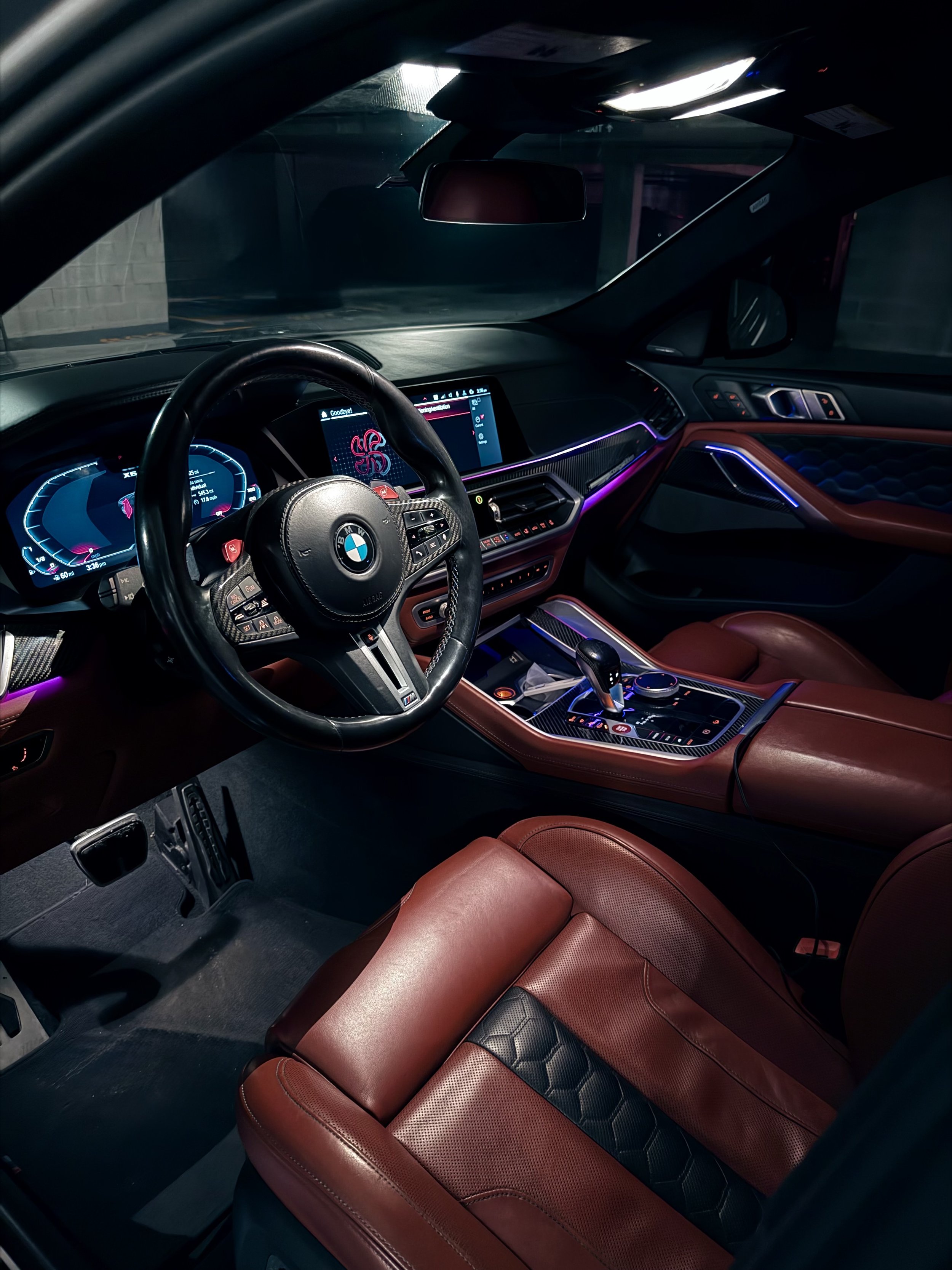 BMW X6 M Competition metallic silver luxury performance SUV with red leather interior