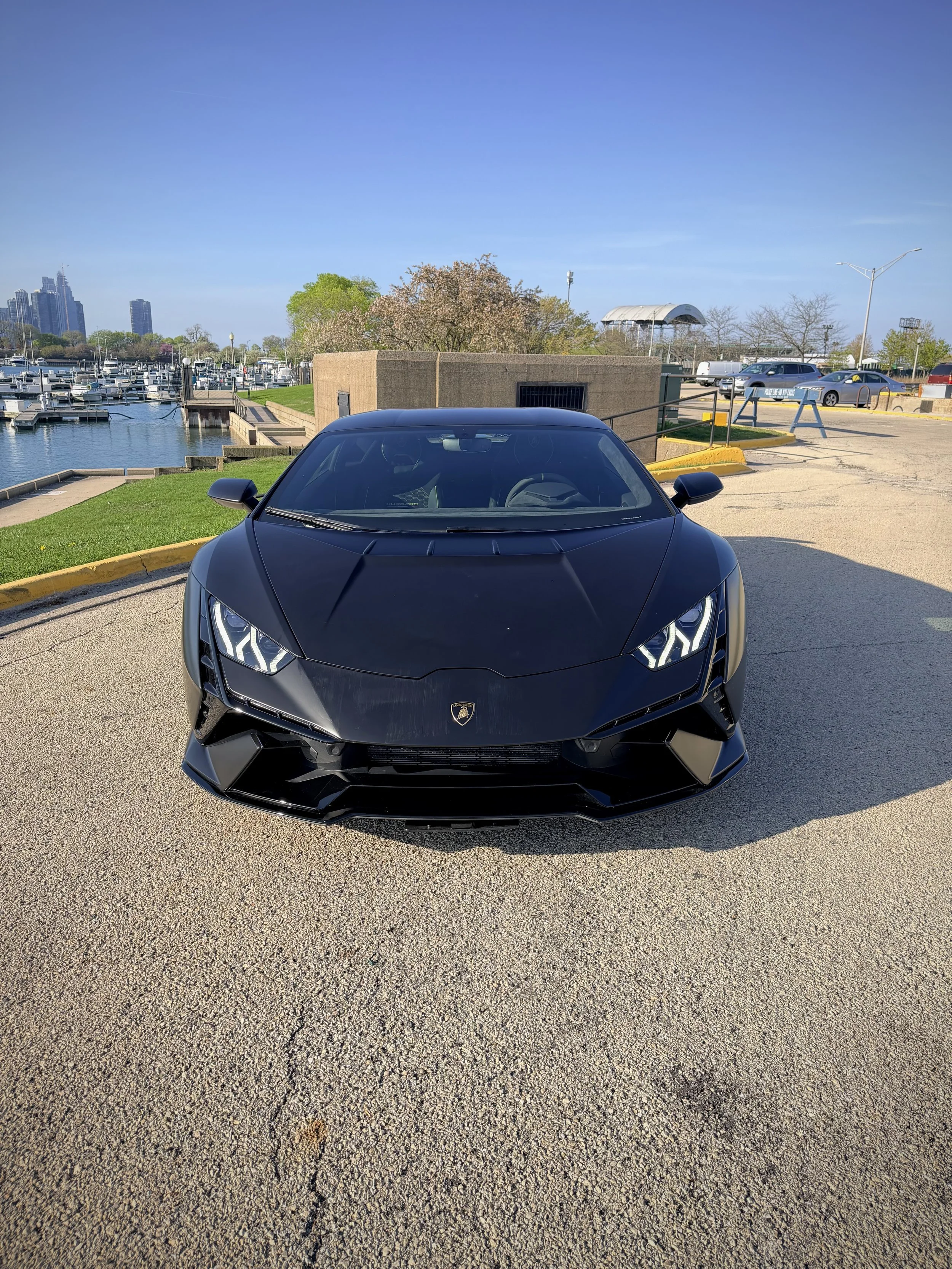 Lamborghini Huracán Tecnica satin black with green brake calipers luxury rental Chicago