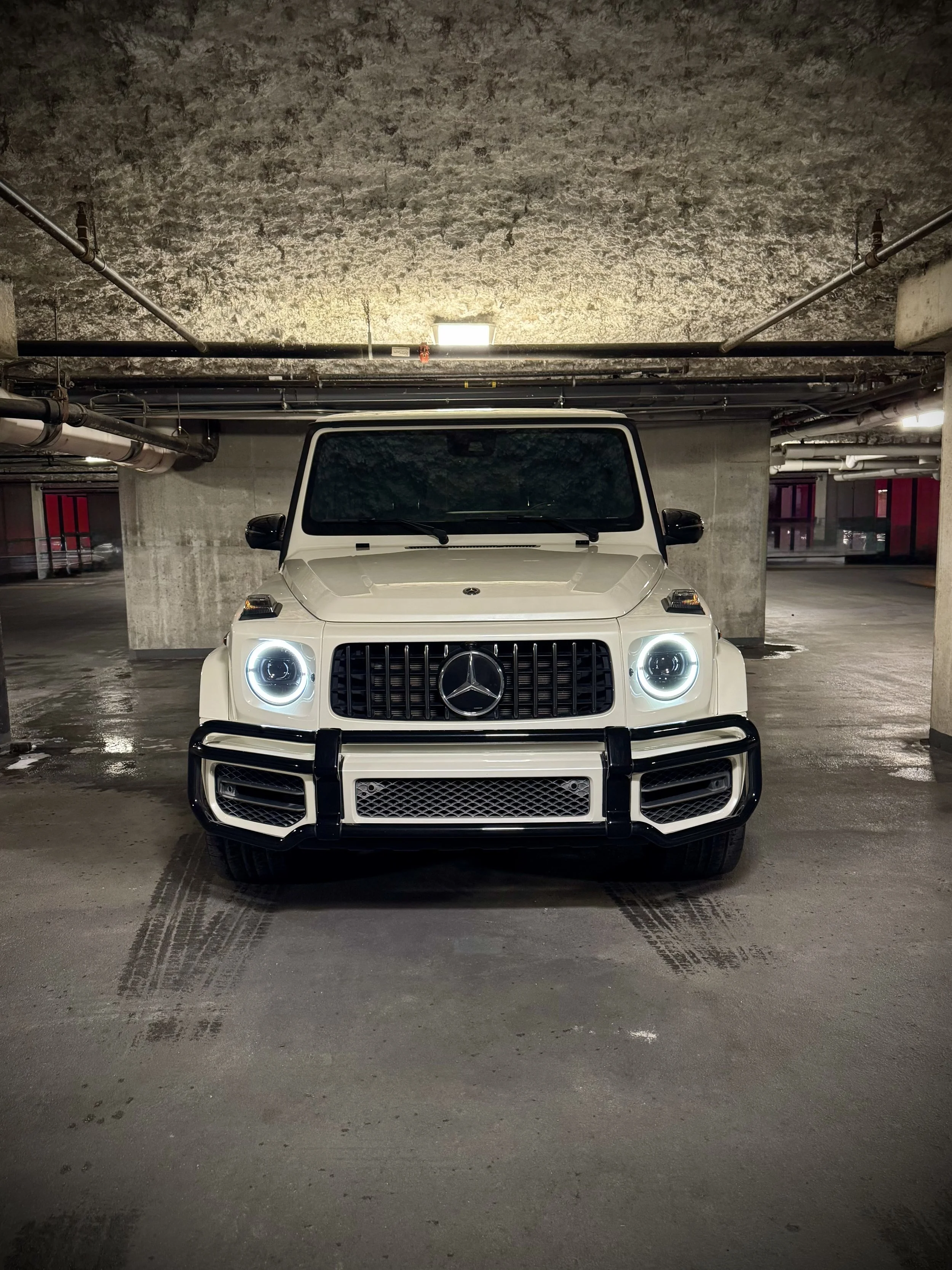 White Mercedes-AMG G63 with black interior, luxury SUV available for rental from Axel Luxury in Chicago.