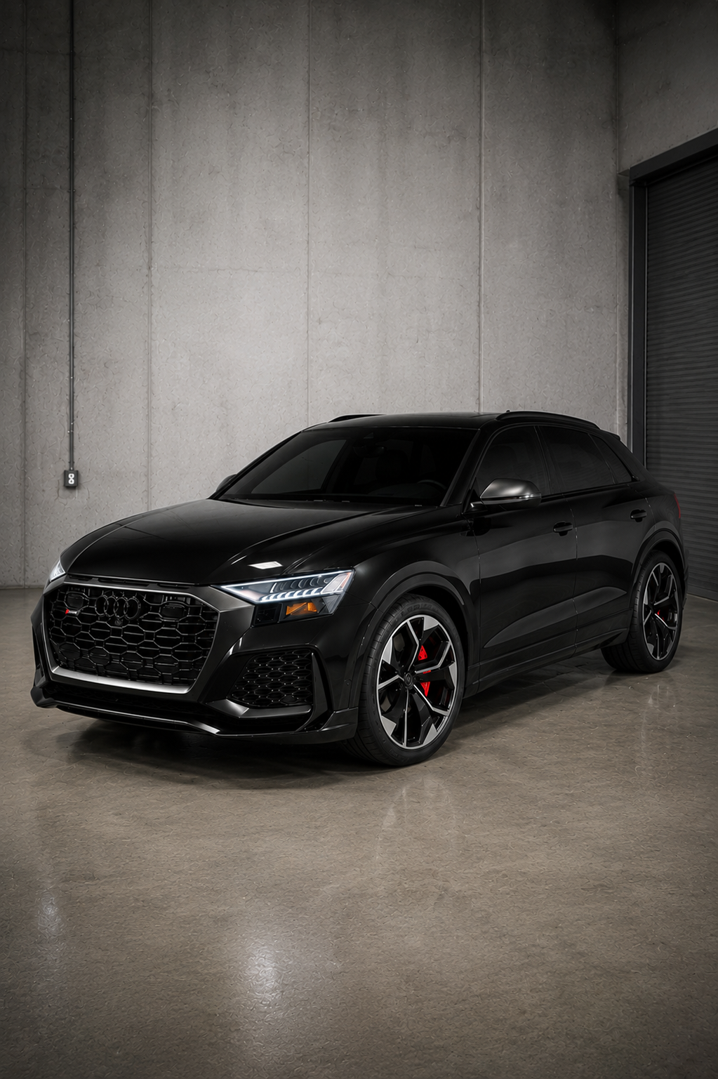 Black Audi RS Q8 rental in Chicago featuring a luxurious tan leather interior, aggressive RS styling, and a high-performance twin-turbo V8 SUV available for luxury and exotic car rental.