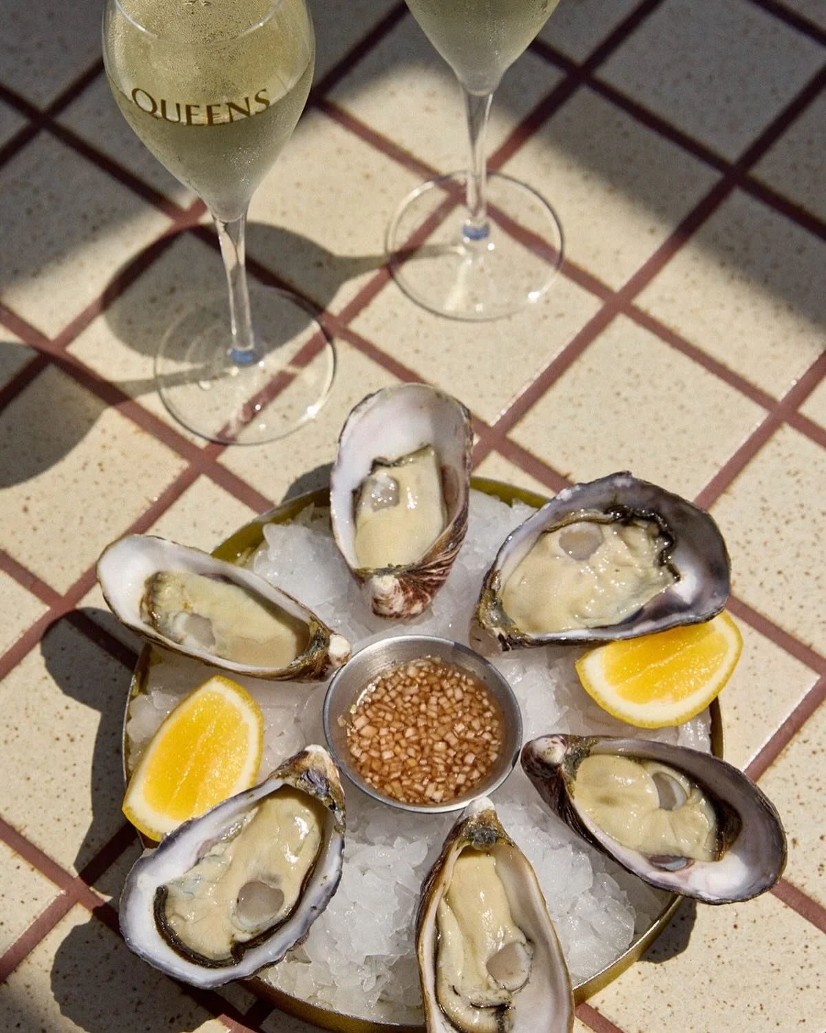 Always a good day for oysters, champagne, and rooftop views at Queens!
