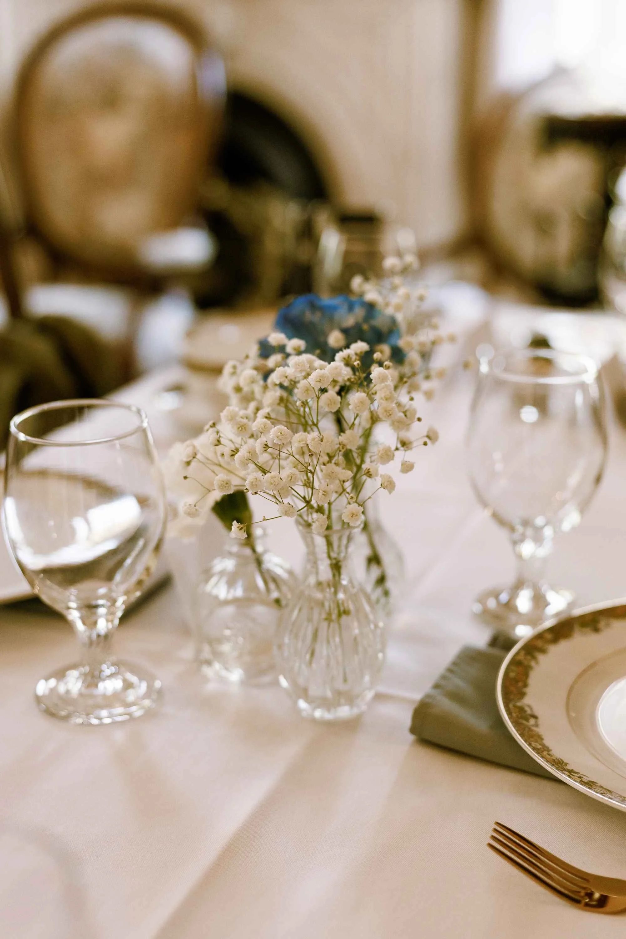 White bridal shower table decorations with babysbreath