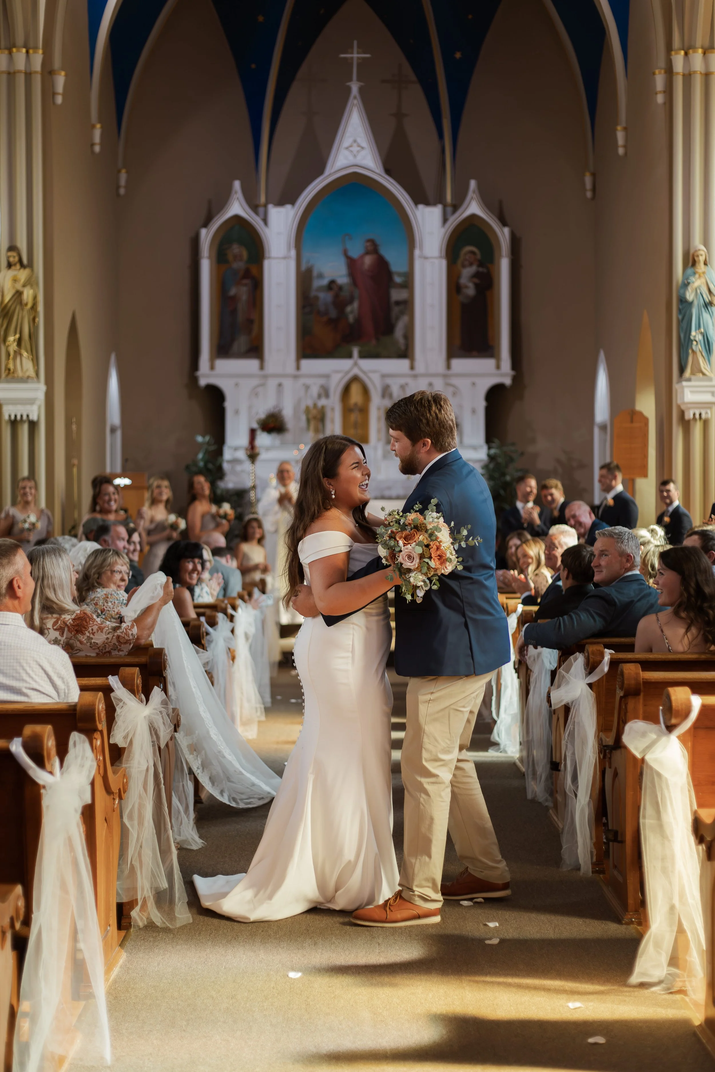 Wedding photography of a bride and groom walking down the church aisle after their ceremony, captured by a Florence, KY wedding photographer.