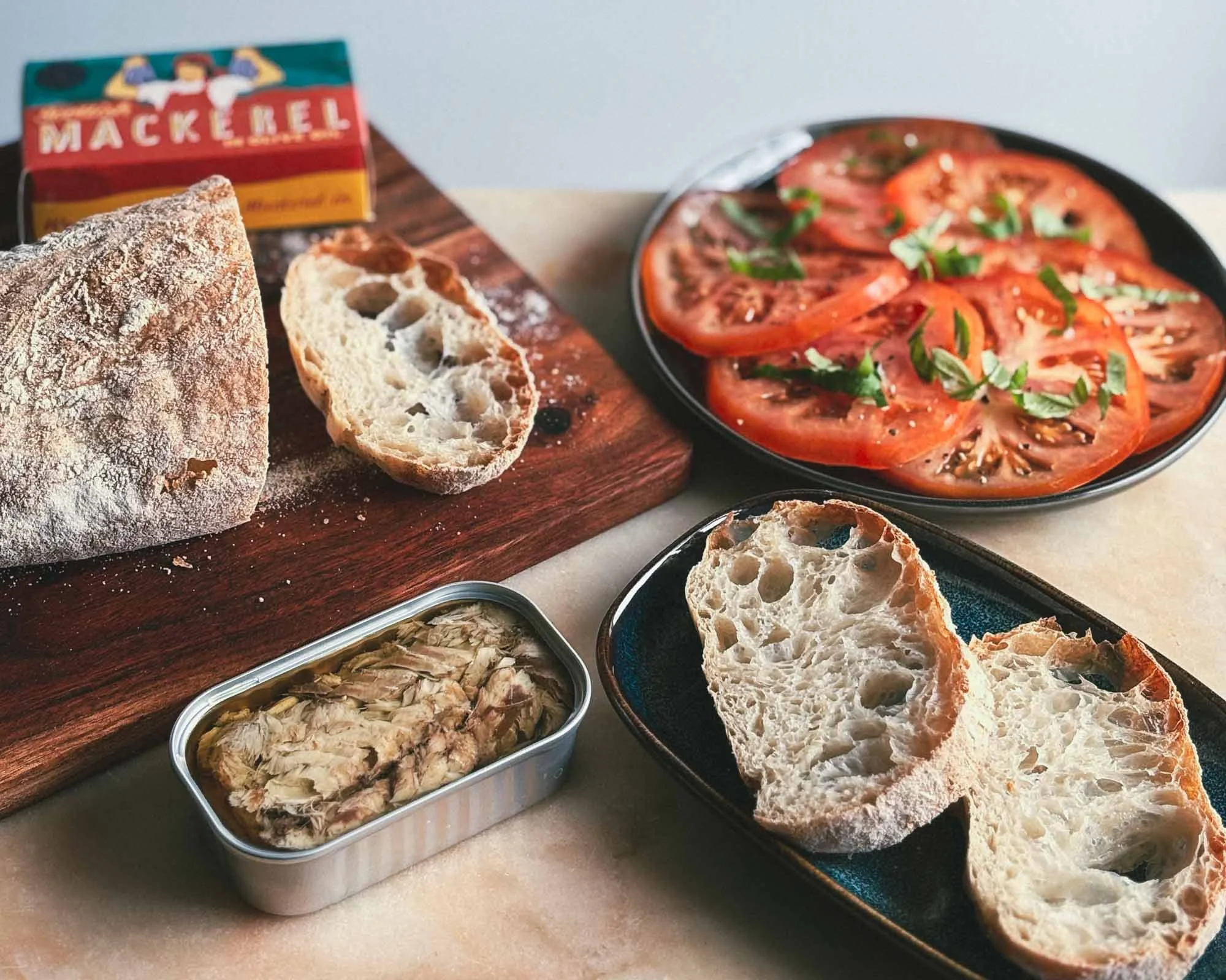 Open tin of Sound Seafood Mackerel Fillet ready to eat with accompaniments