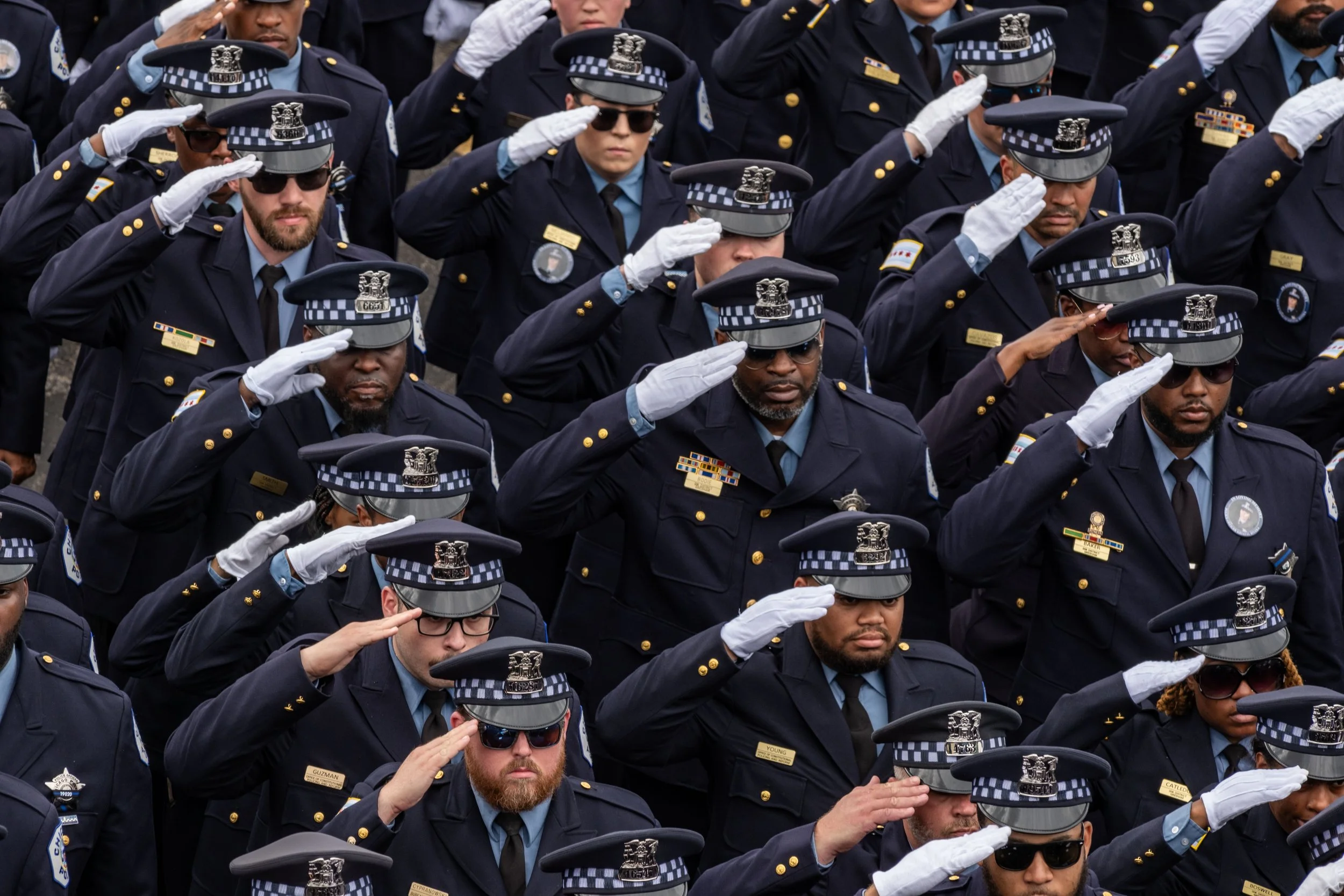 Chicago Police salute the casket of Officer Krystal Rivera during her funeral held at Living Water Church in Forest Park, Illinois.