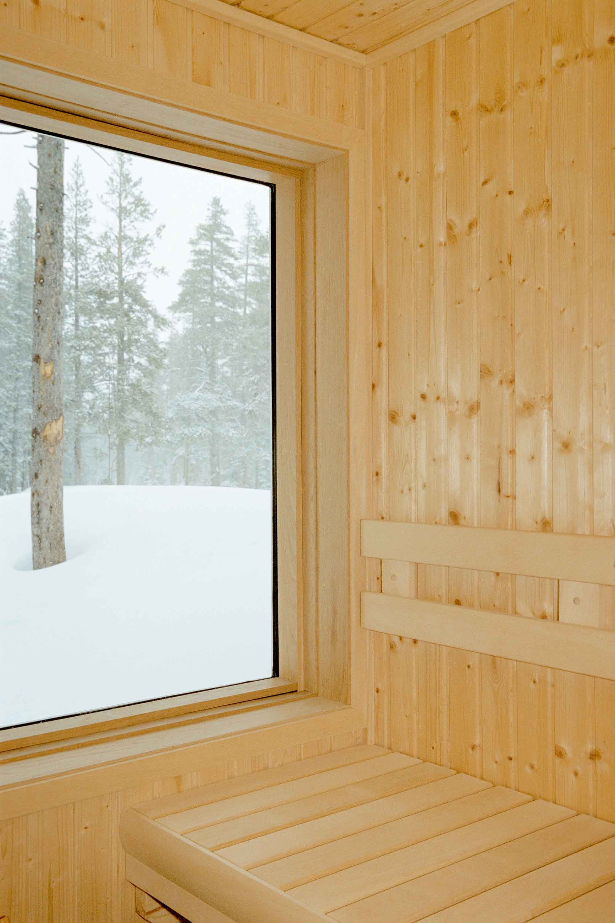Custom wood sauna with warm cedar interiors, clean lines, and a relaxing spa-like alpine atmosphere
