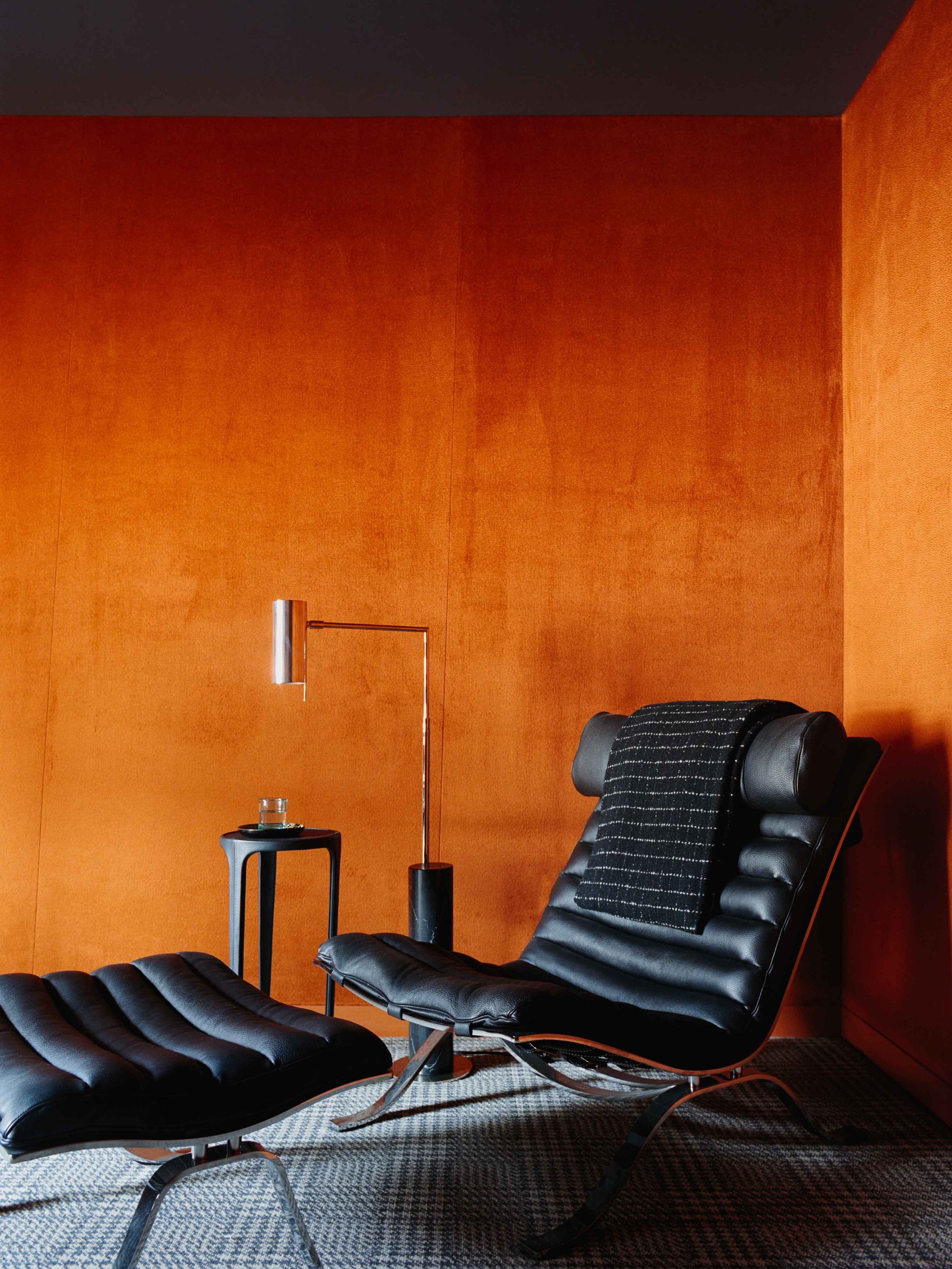 Minimal home office with bold, warm tones and natural light