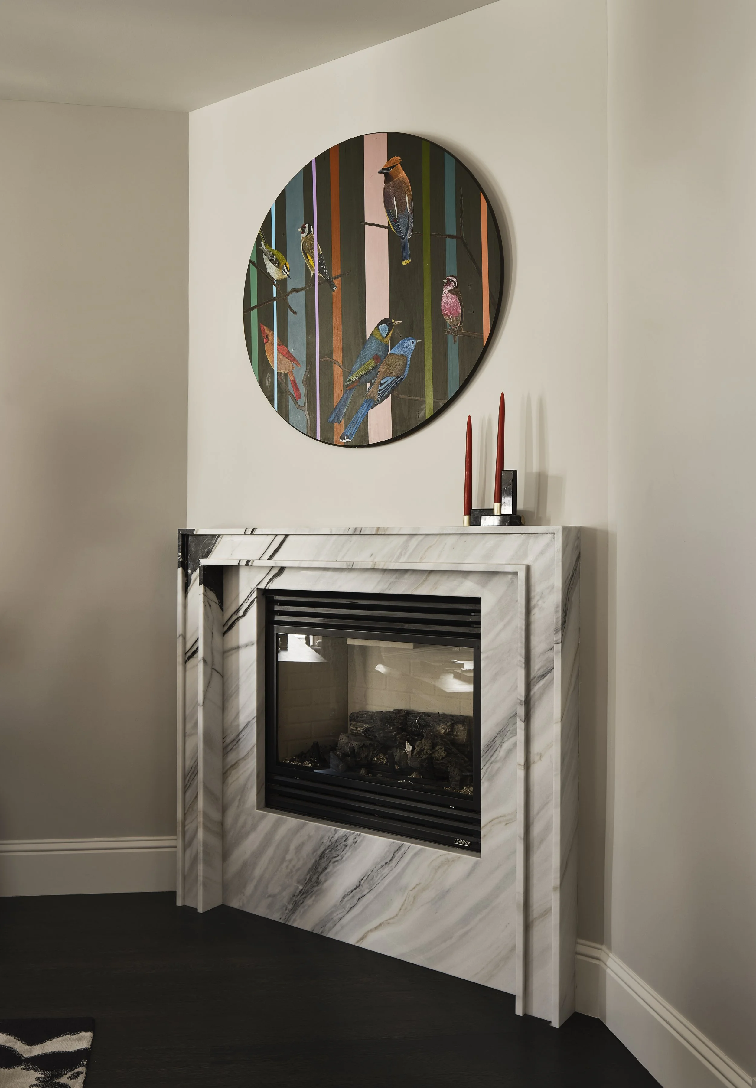 San Francisco living room with marble stone fireplace designed by Eva Bradley Studio featuring vibrant colors, layered textures, and curated contemporary art