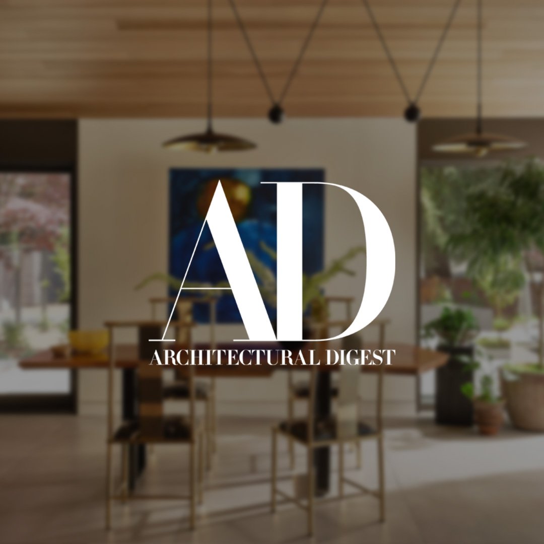 Mid-century dining room with warm lighting designed by Eva Bradley Studio written about by and featured in Architectural Digest