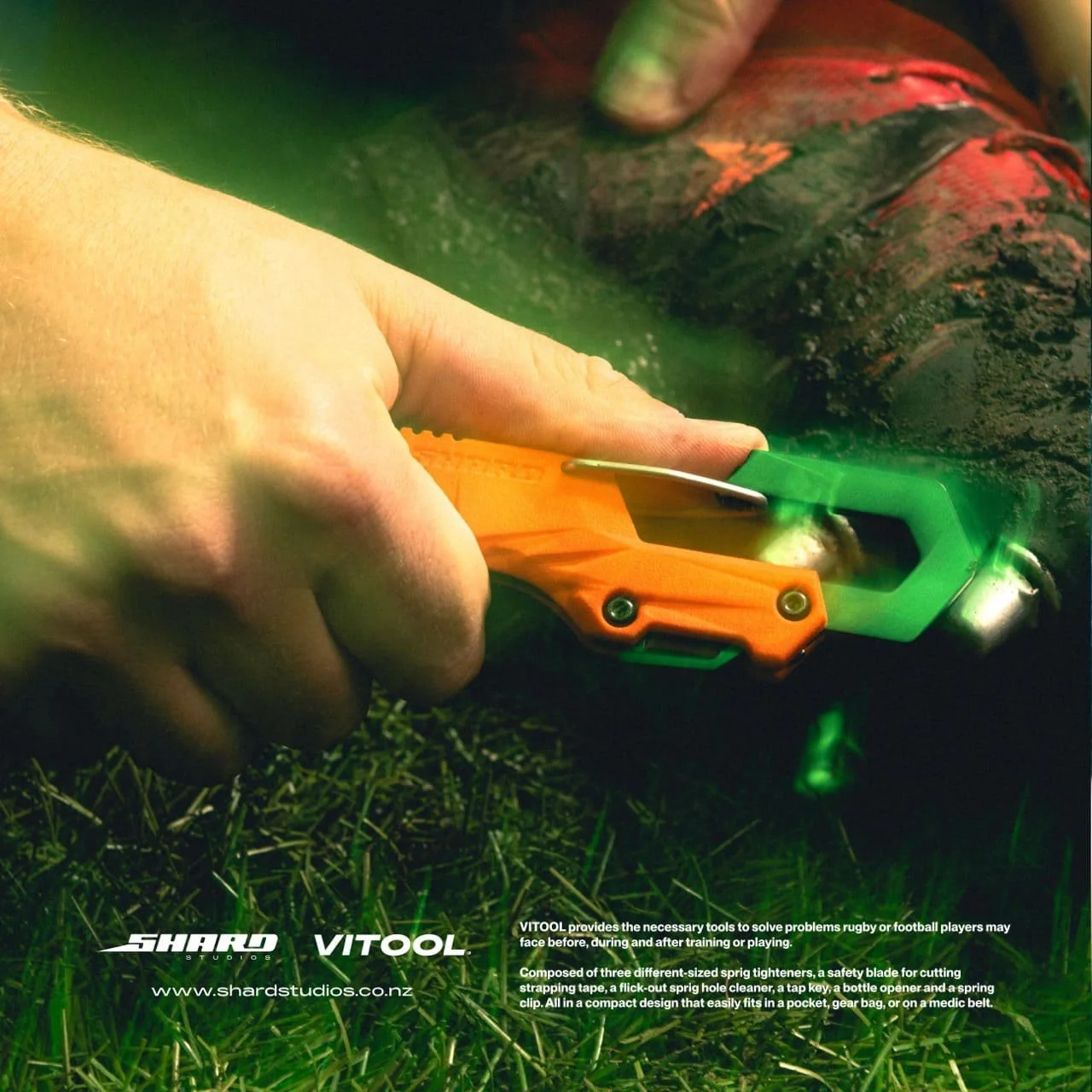 Rugby player using Vitool to adjust boot studs